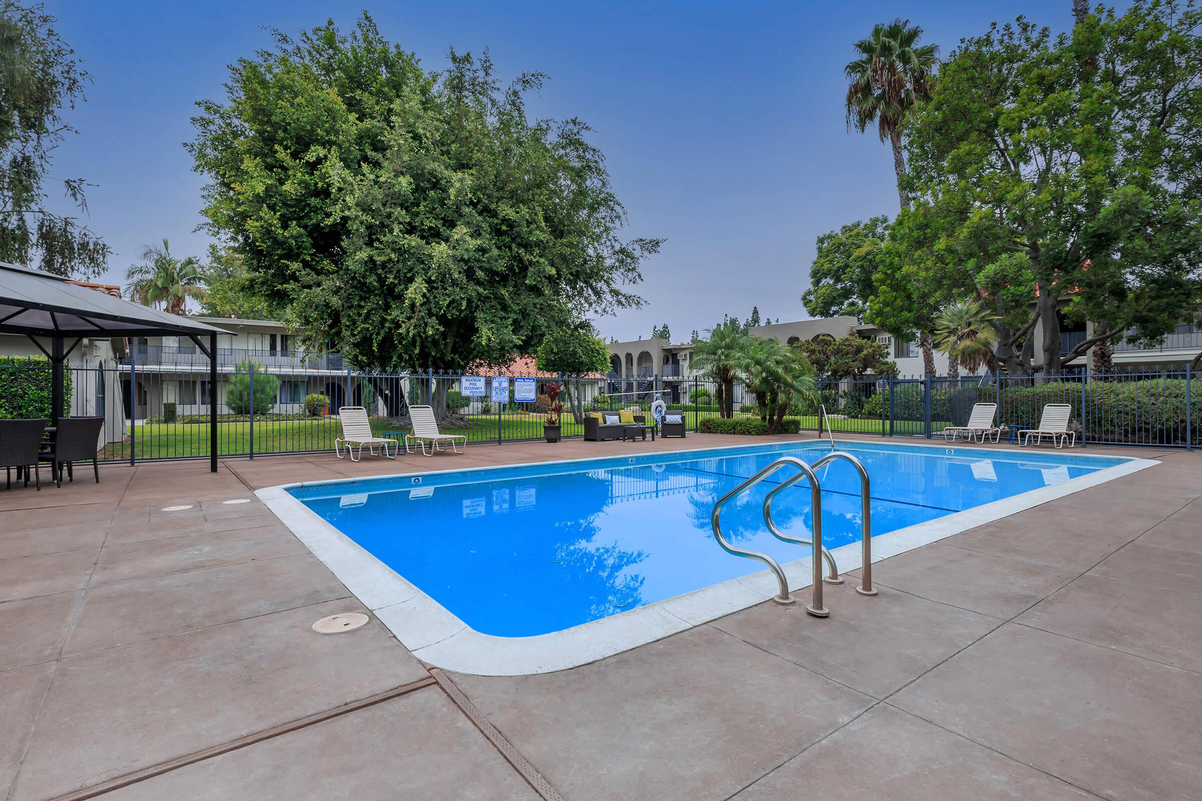 Vio Cerritos community pool with greenery