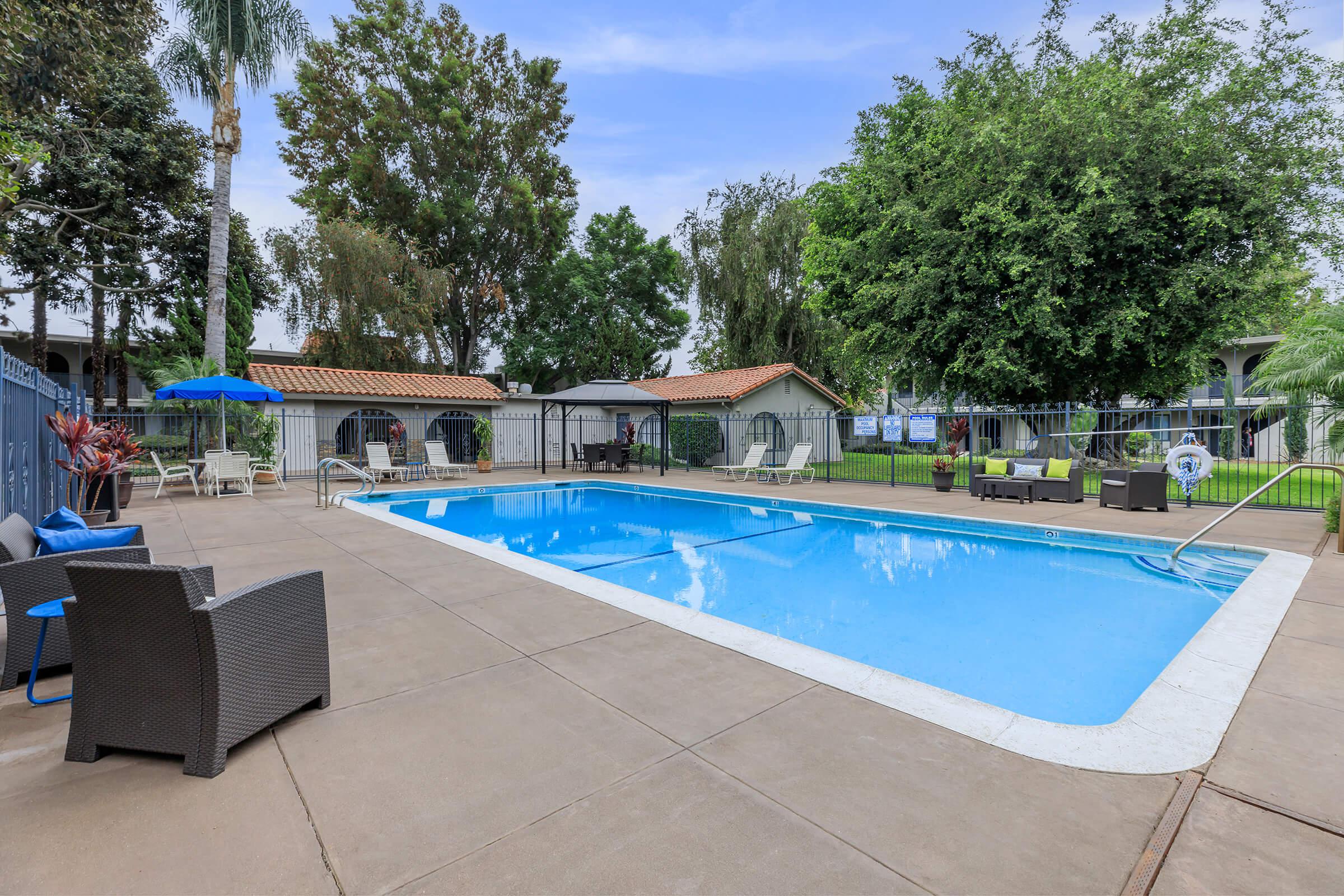 Vio Cerritos community pool with chairs