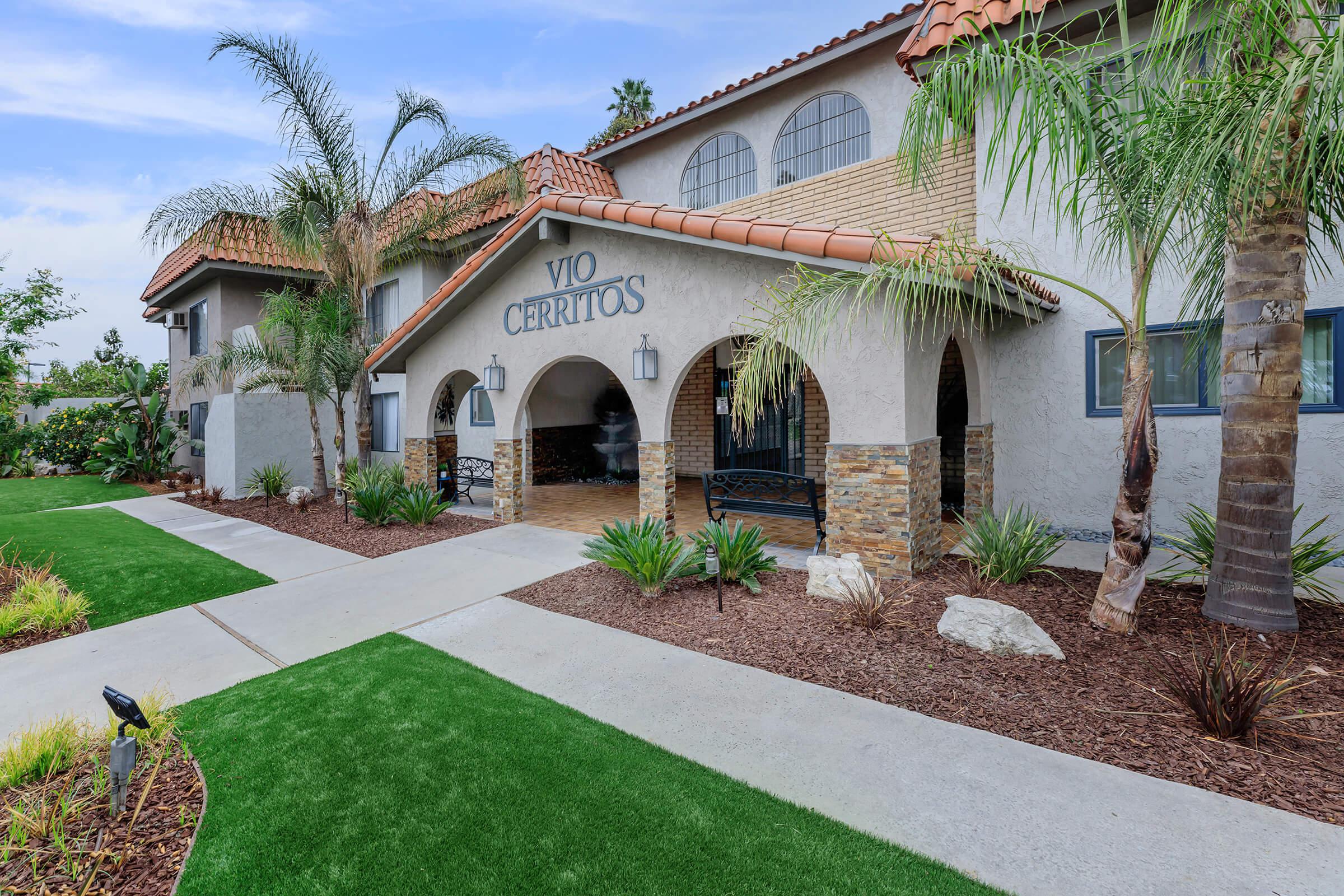 Vio Cerritos leasing office with green grass