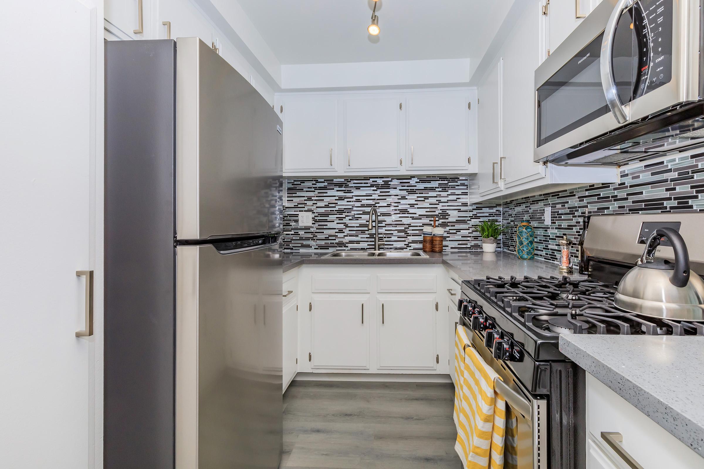 a kitchen with a stove and a sink