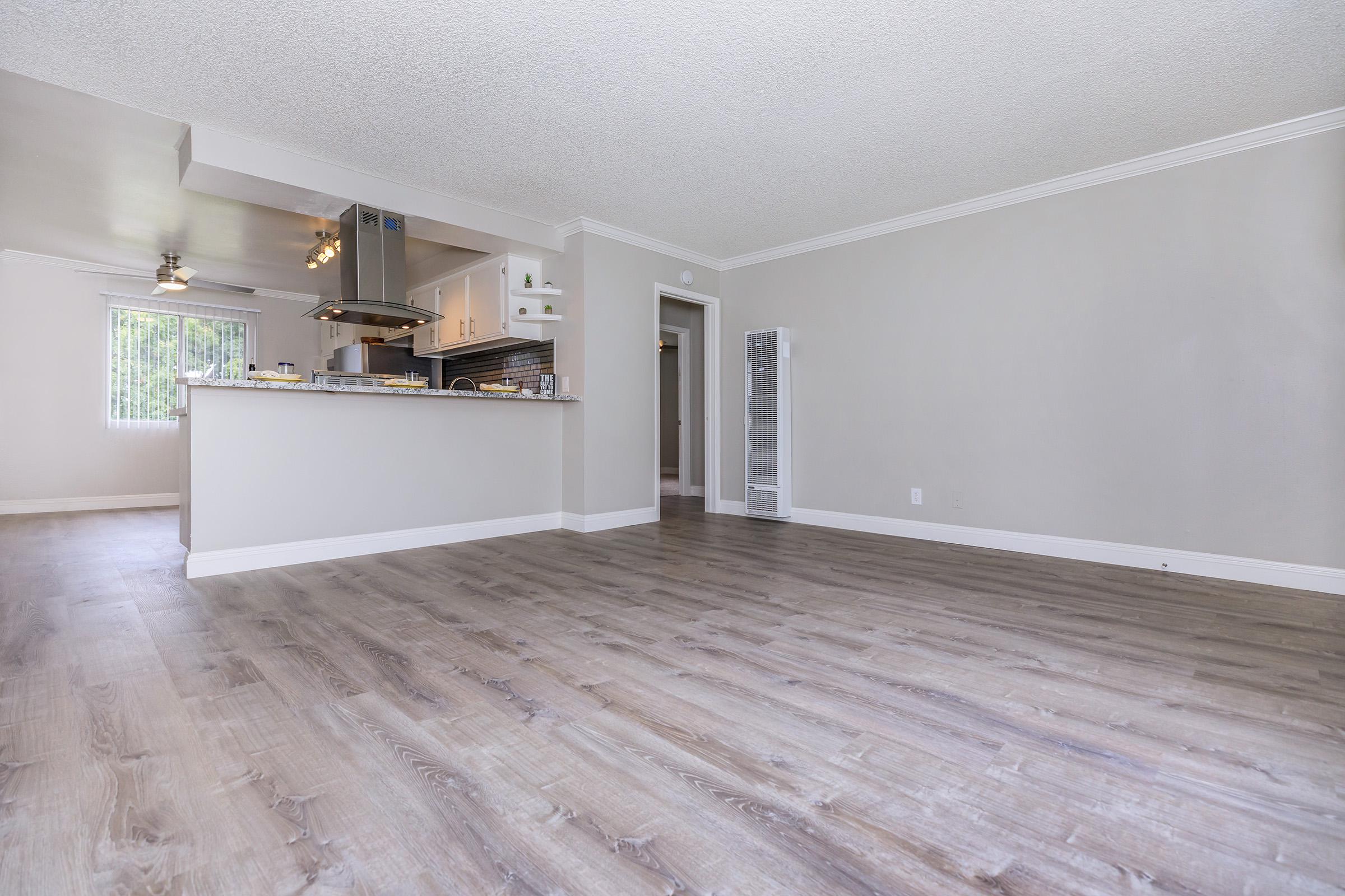 Living room and dining room with wooden floors