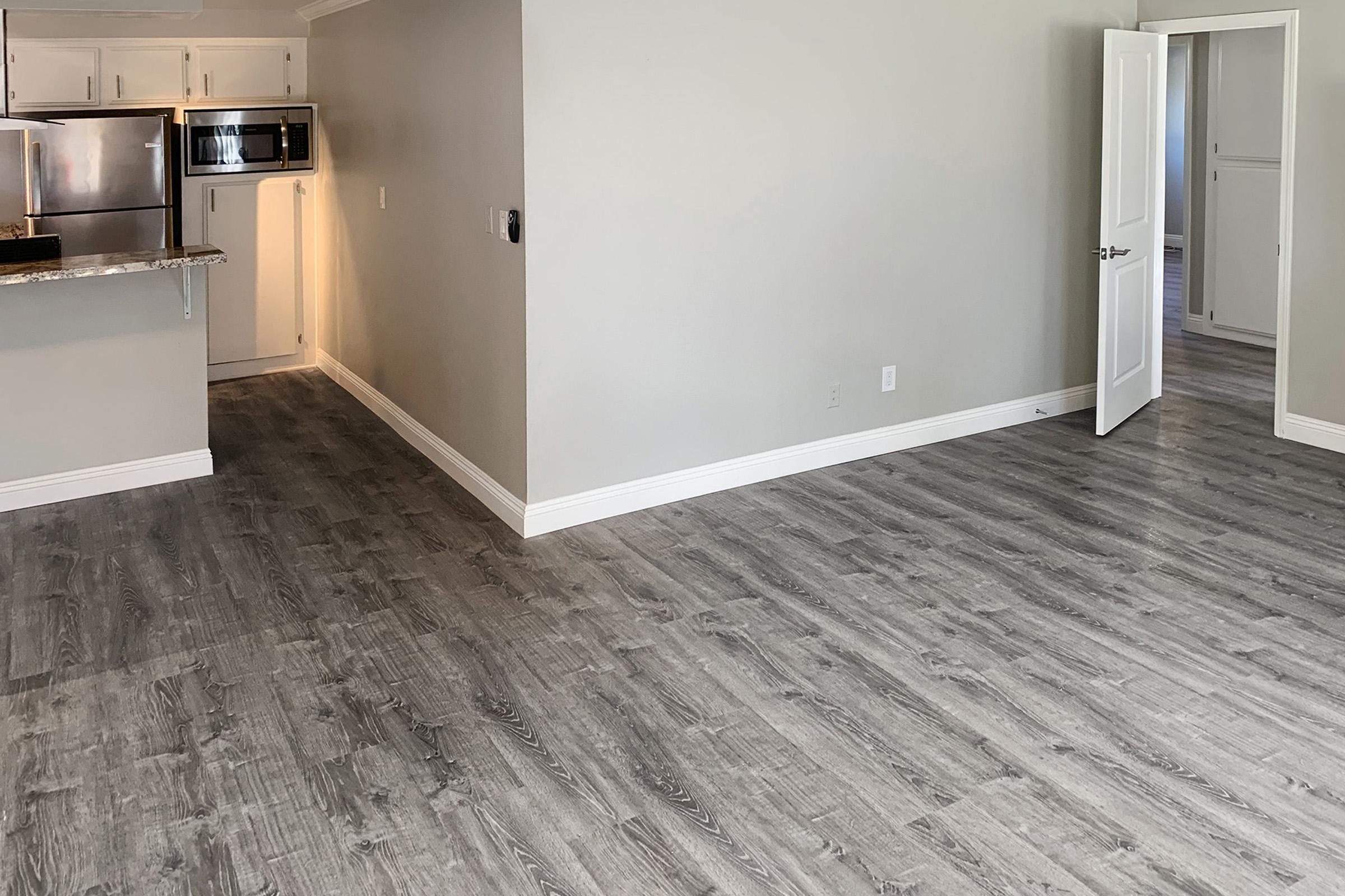 Vacant living room with wooden floor