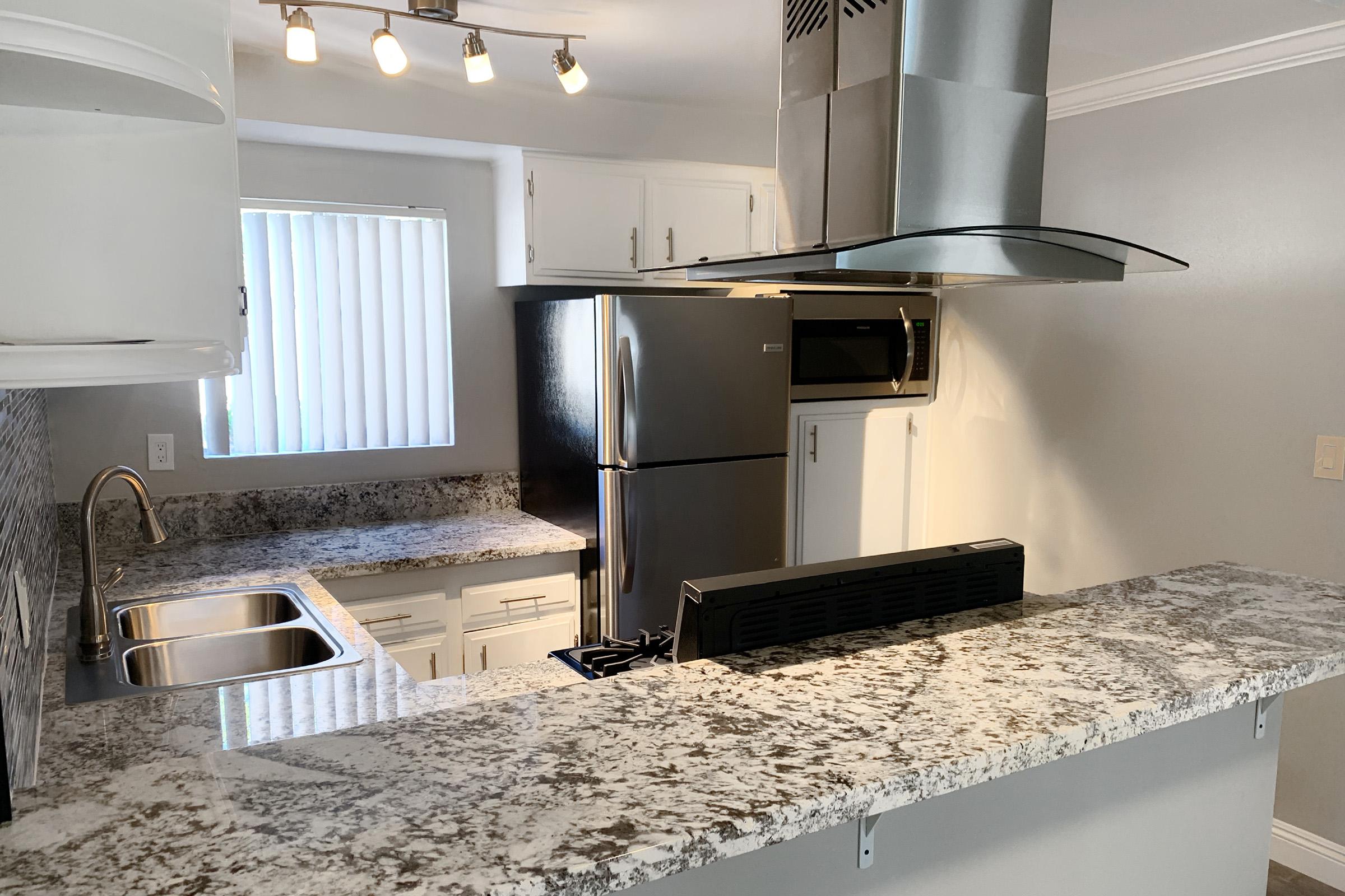 Kitchen with stainless steel appliances and granite countertops