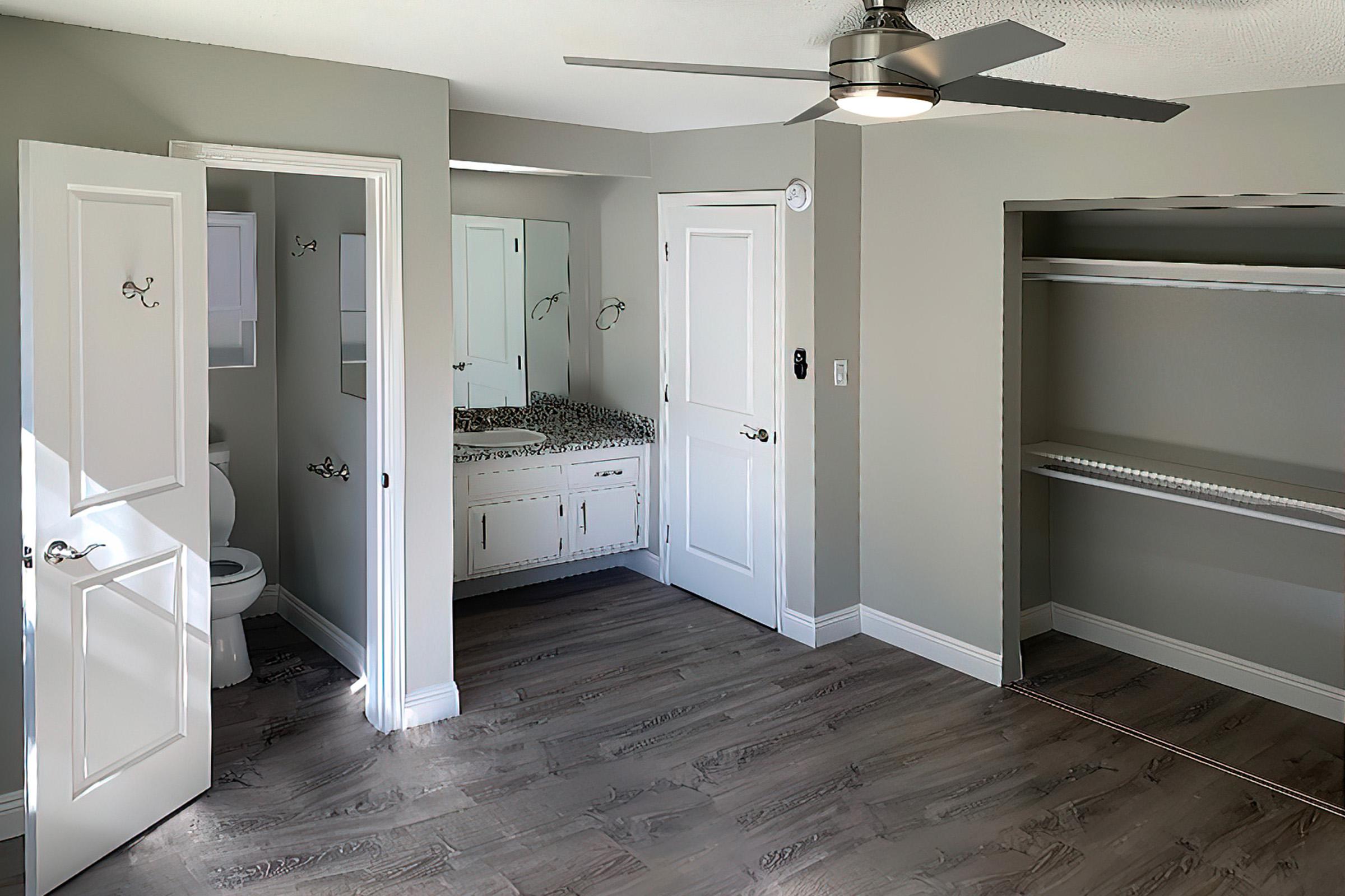 Vacant bedroom with wooden floors