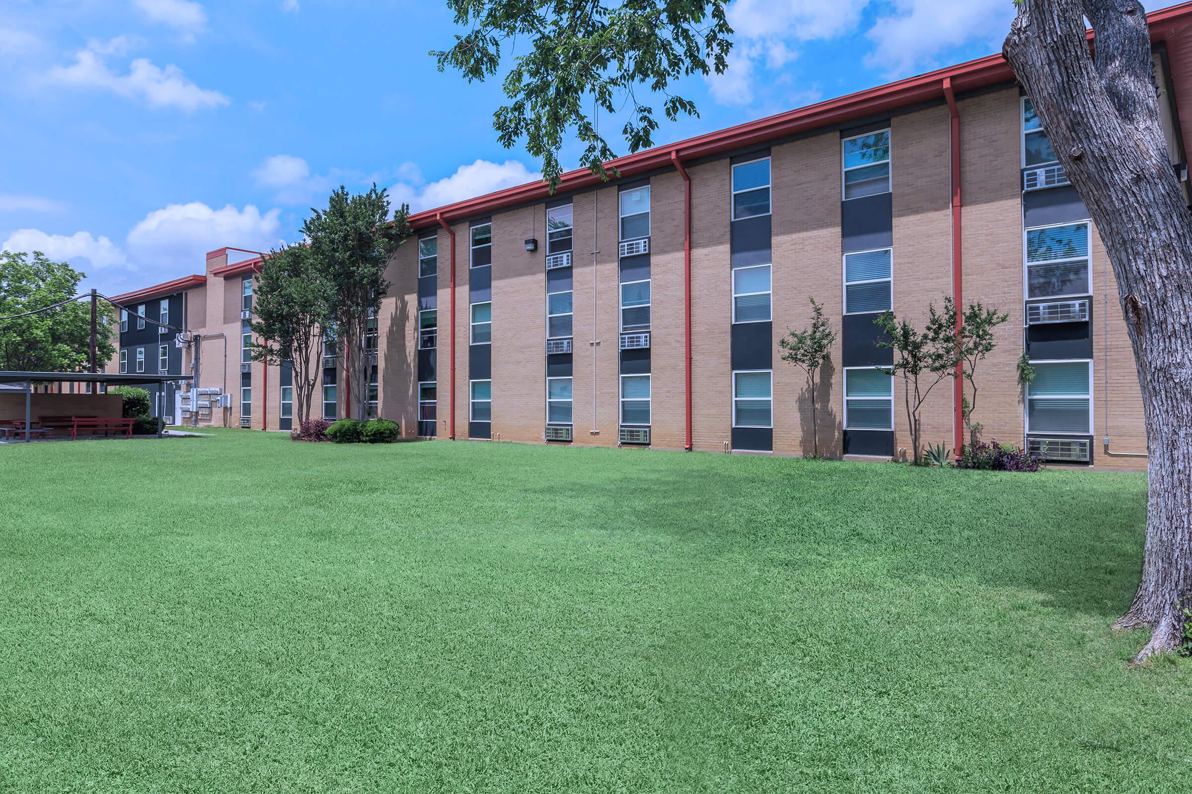 a large lawn in front of a building