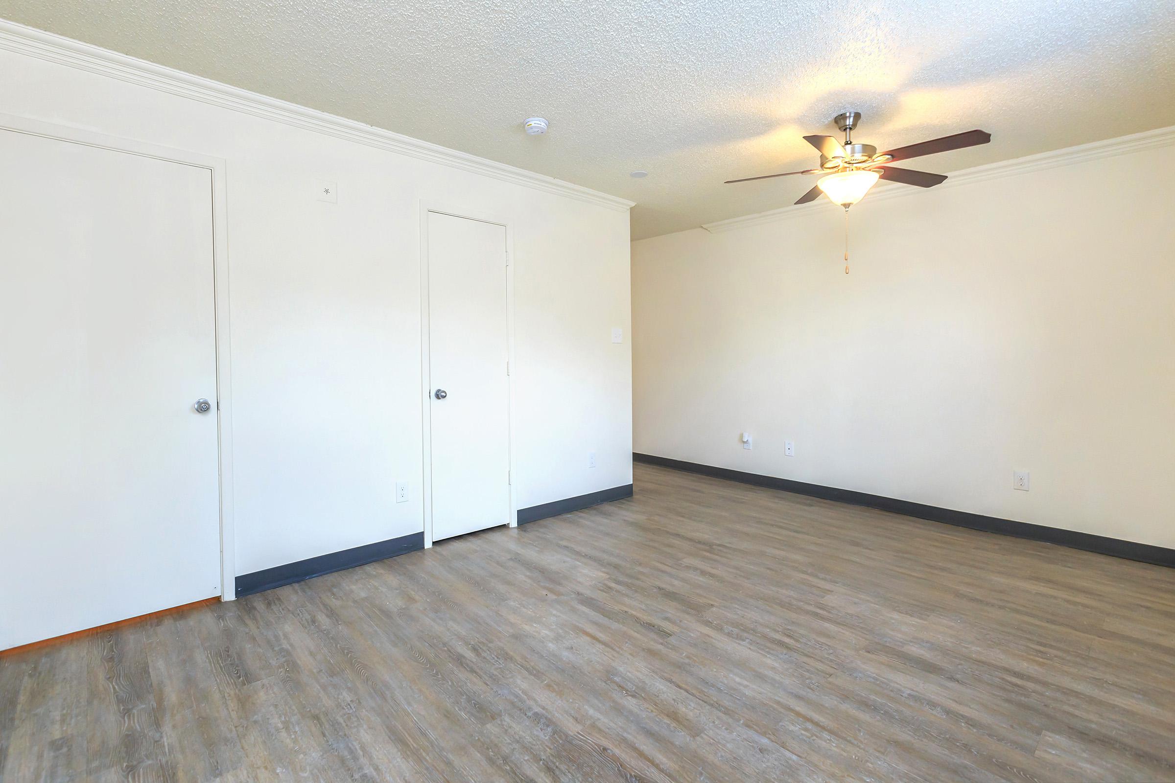 a kitchen with a wooden floor