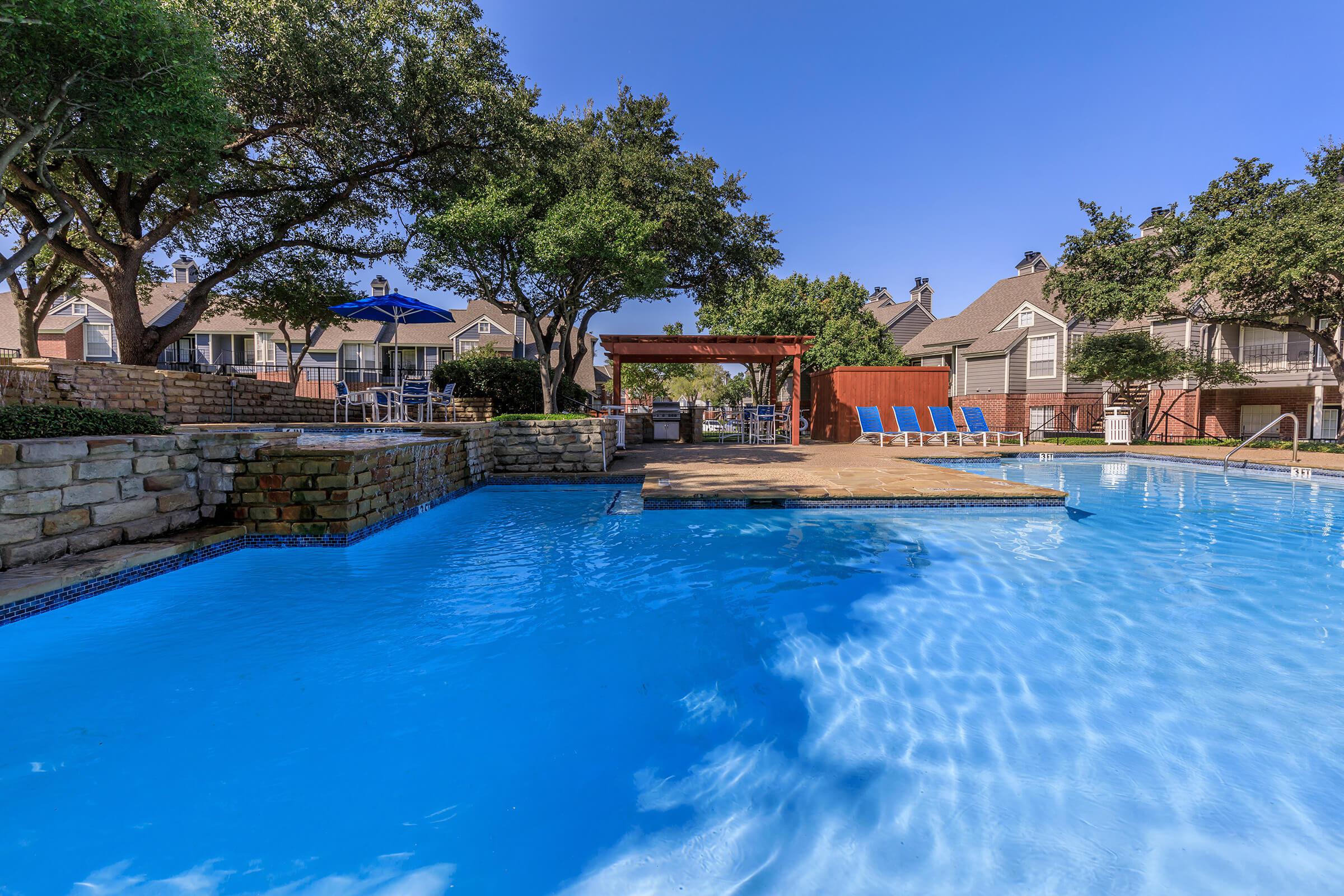 a house with a large pool of water