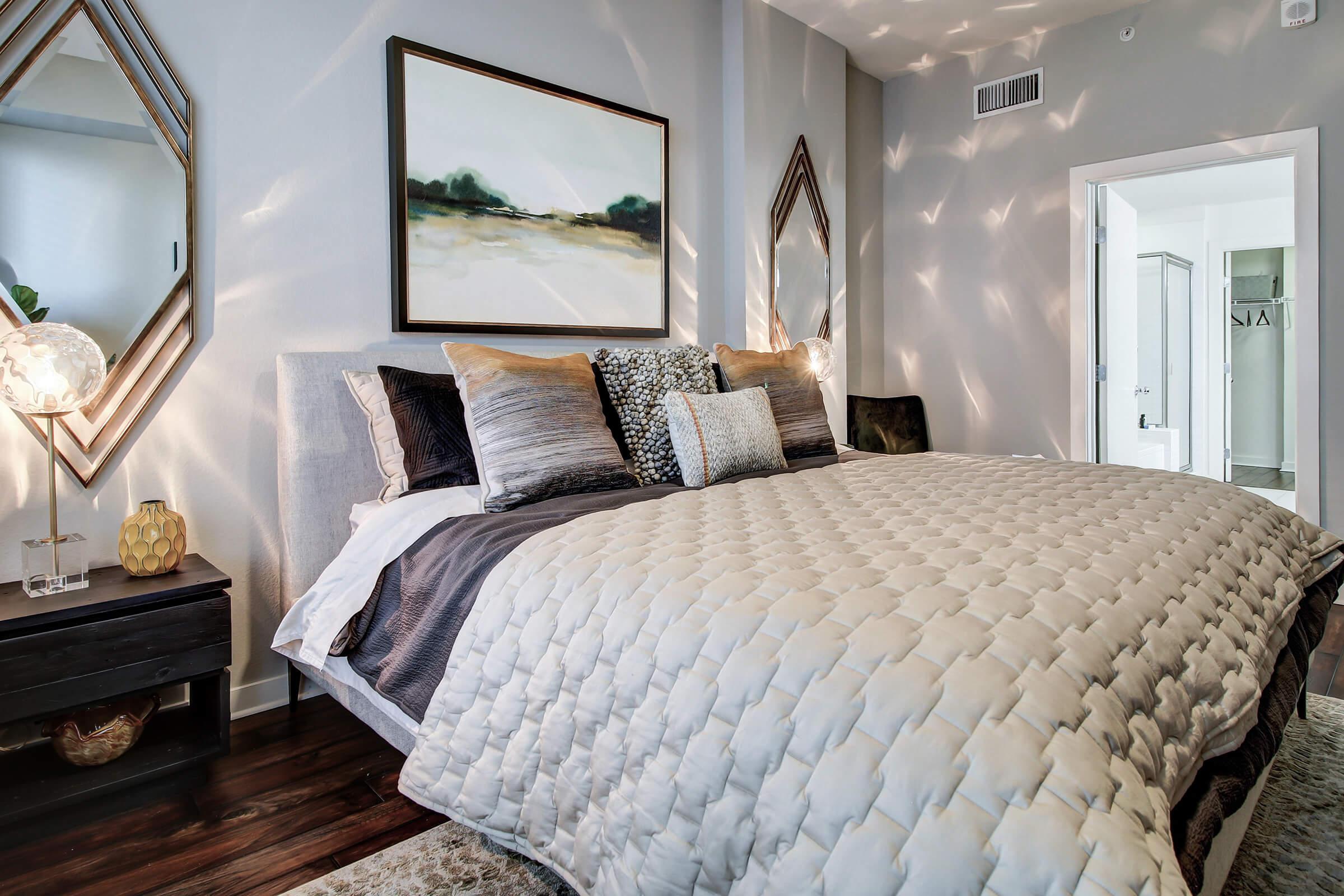 bedroom with a grey comforter