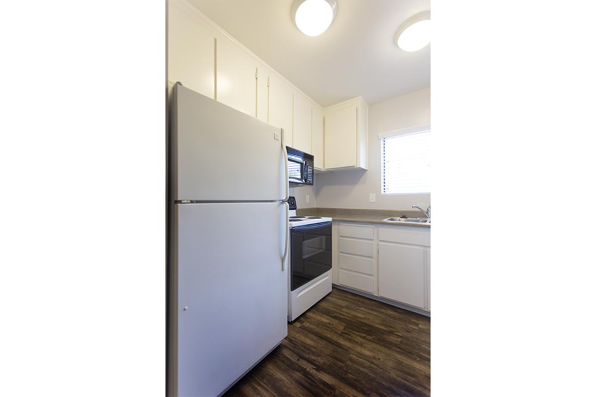 a large white refrigerator in a kitchen