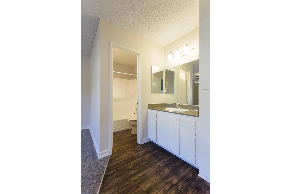 a room with a sink and a mirror