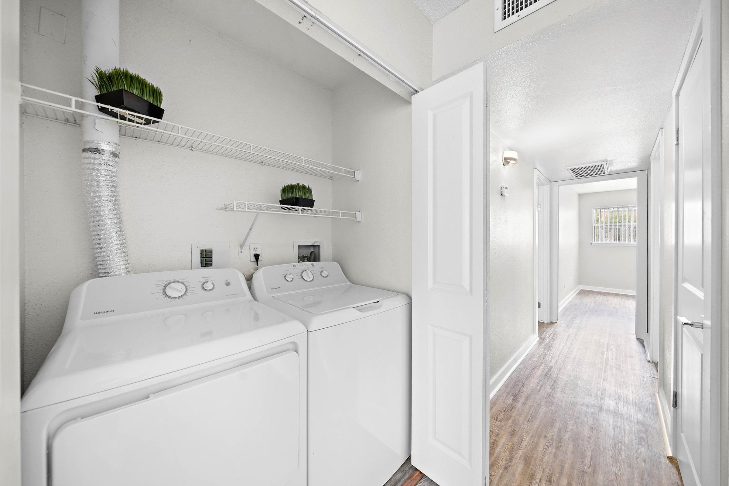 a kitchen with a sink and a mirror