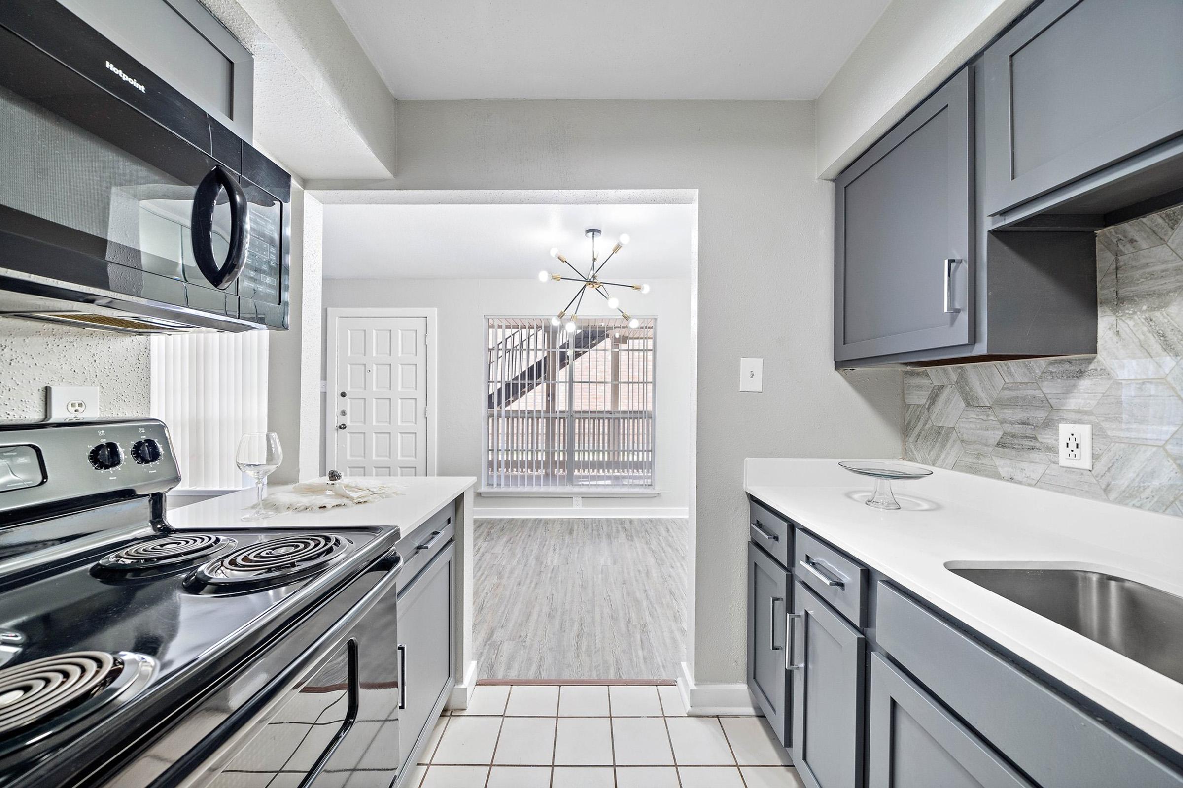 a kitchen with a stove top oven