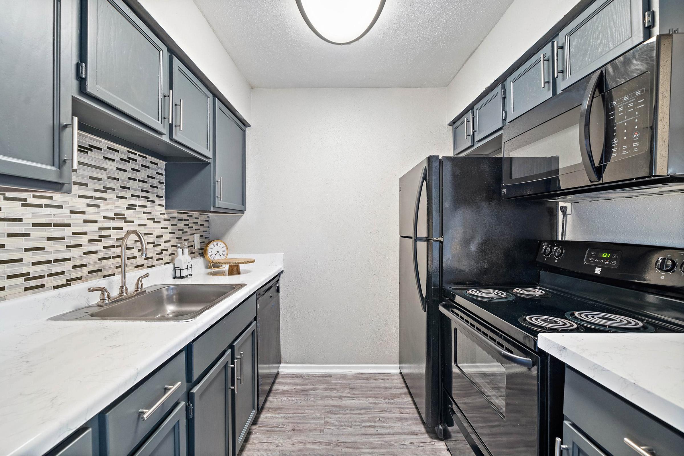 a kitchen with a stove top oven