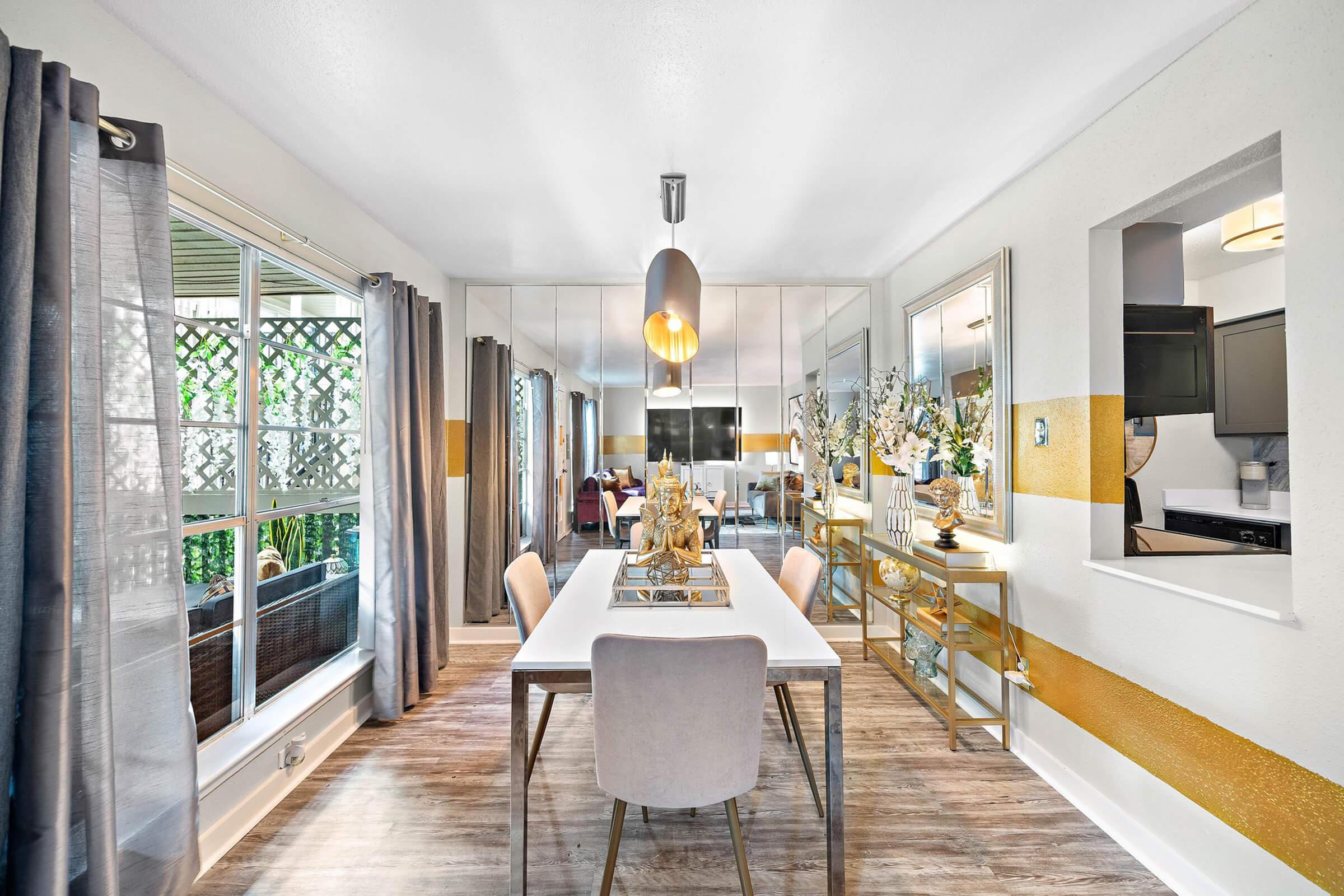 a dining room table in front of a window