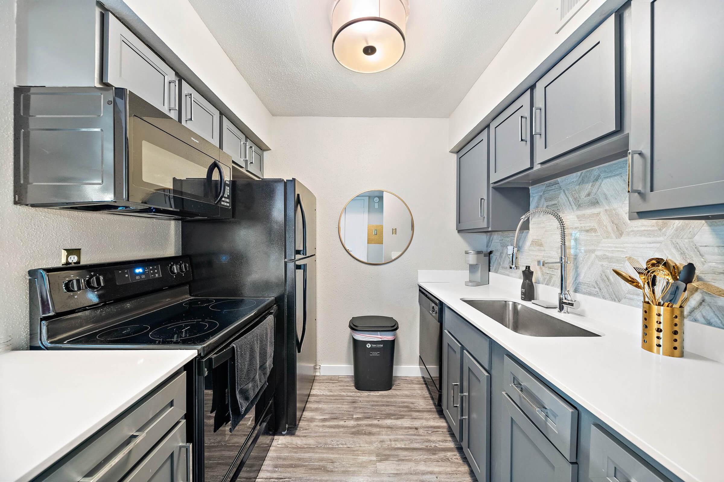 a modern kitchen with stainless steel appliances