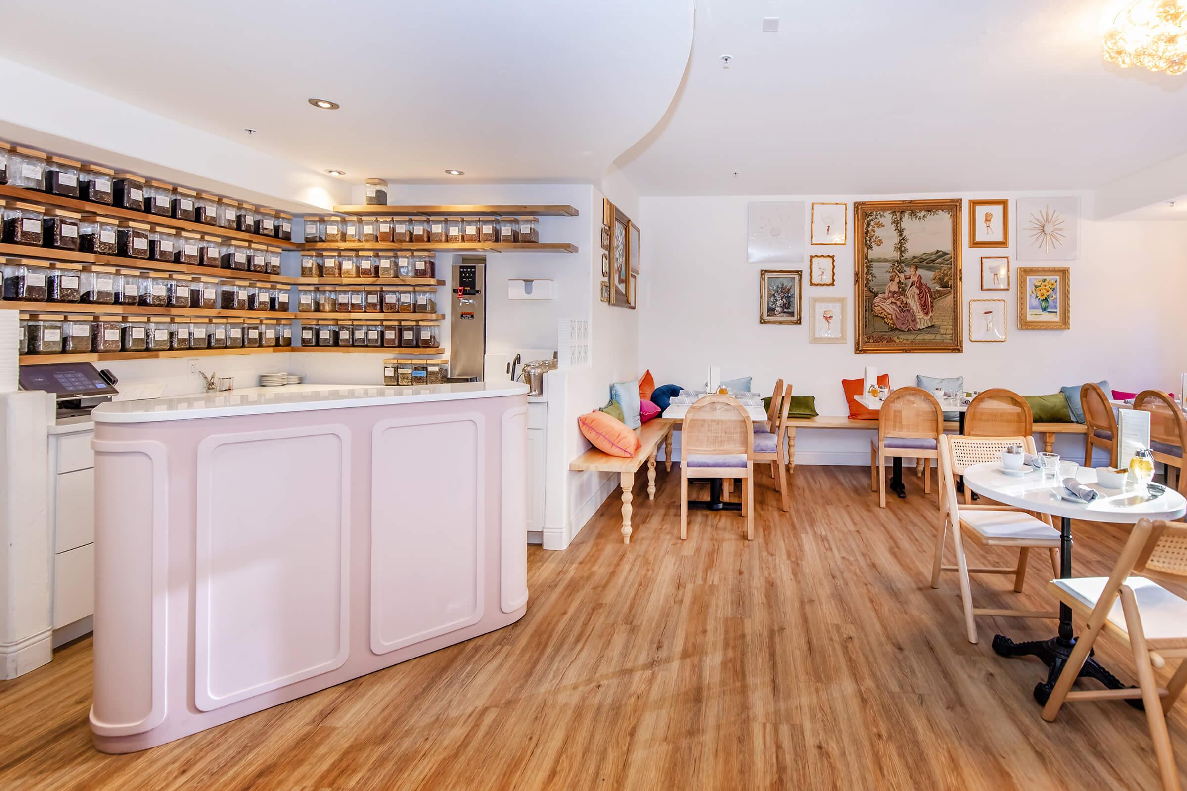 a room filled with furniture on top of a hard wood floor