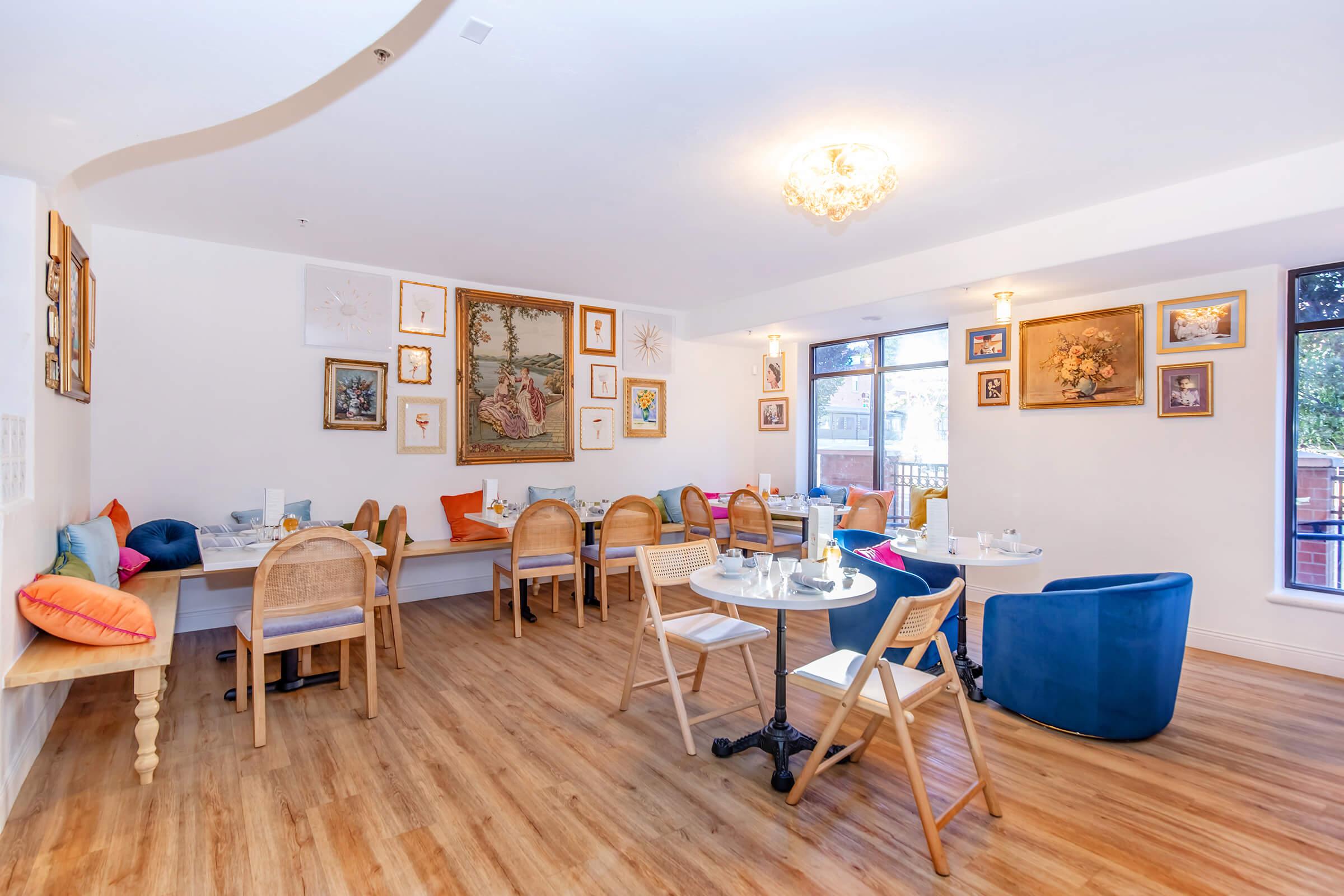 a living room filled with furniture on top of a hard wood floor