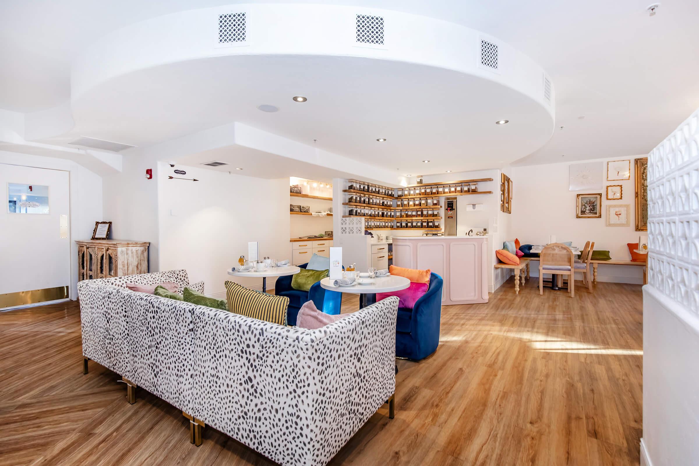 a room filled with furniture on top of a hard wood floor