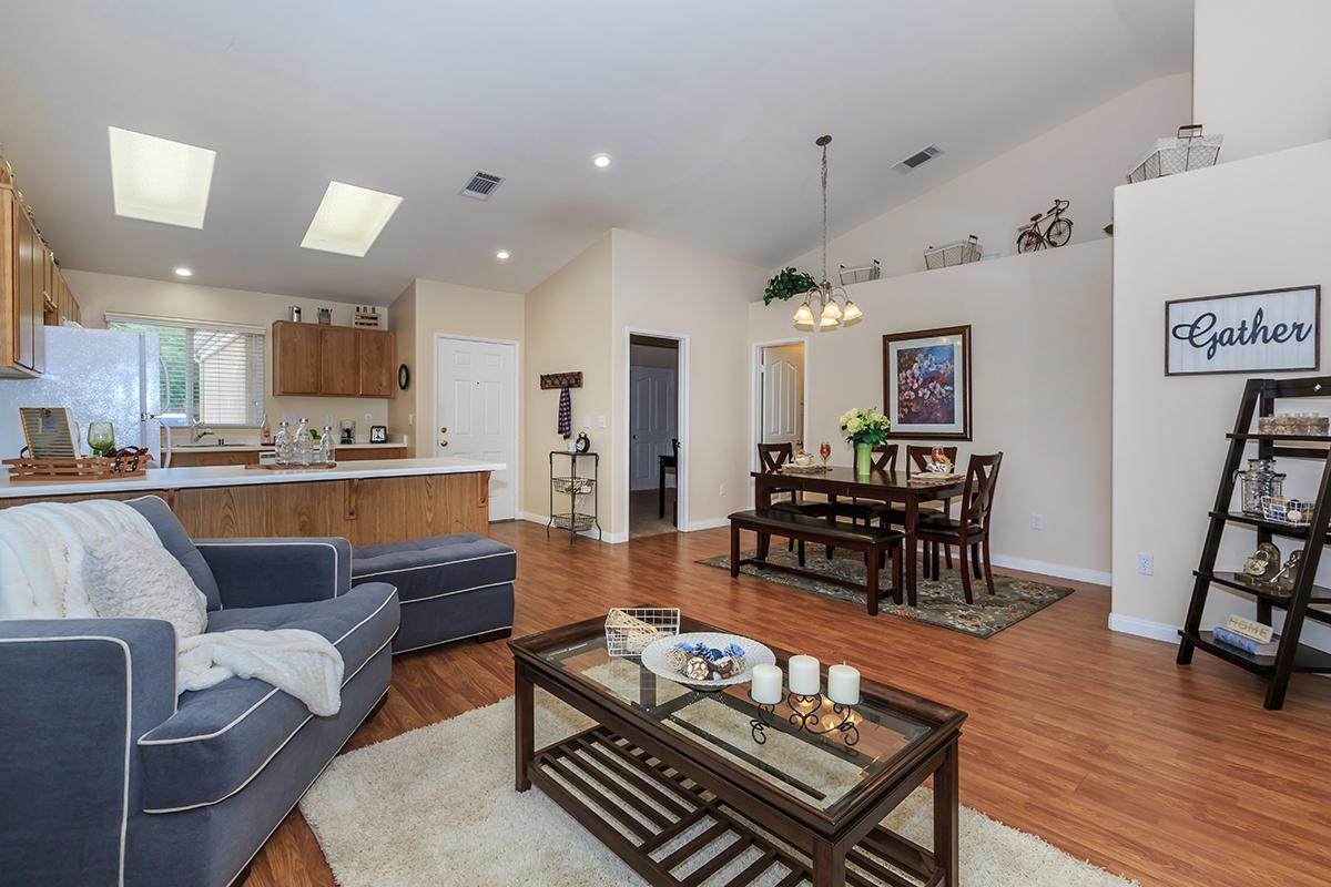 a living room filled with furniture and a table