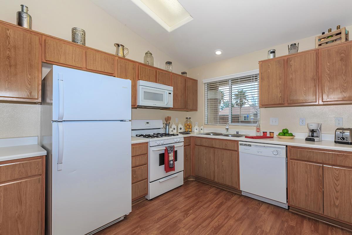 a kitchen with a stove and a refrigerator