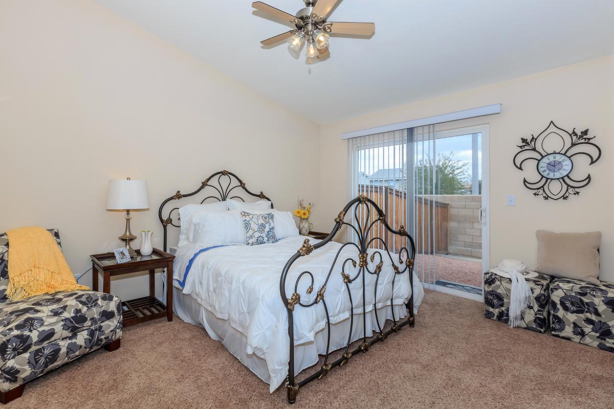 a bedroom with a bed in a room