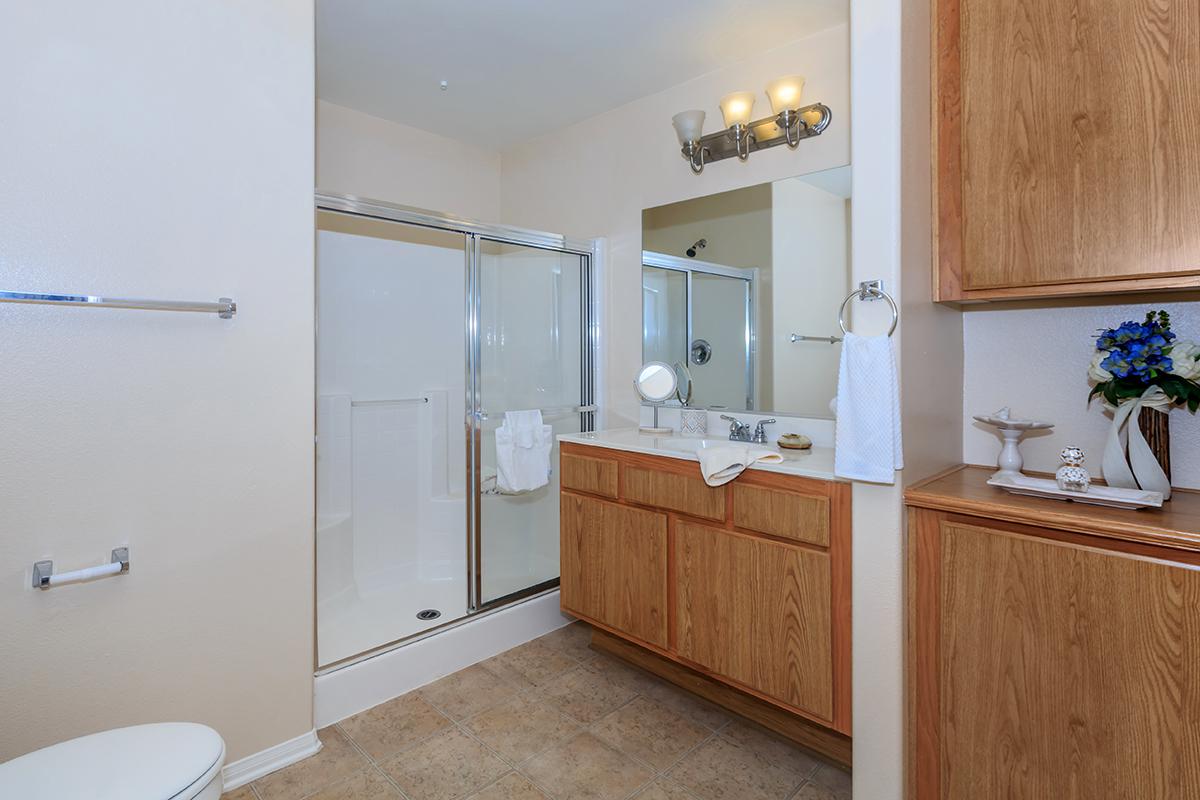 a kitchen with a sink and a mirror