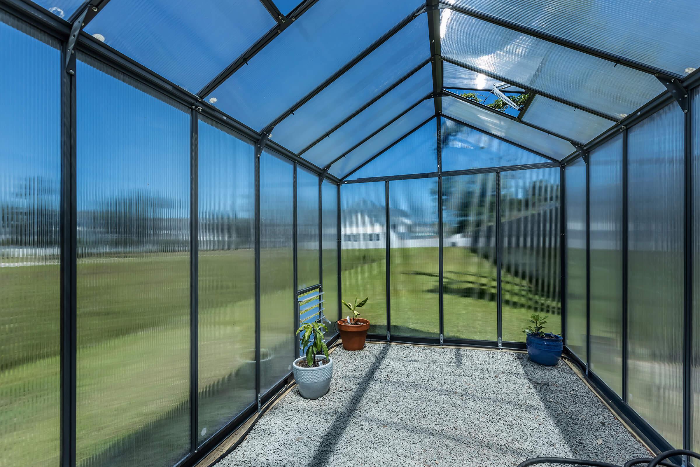 a glass door next to a fence