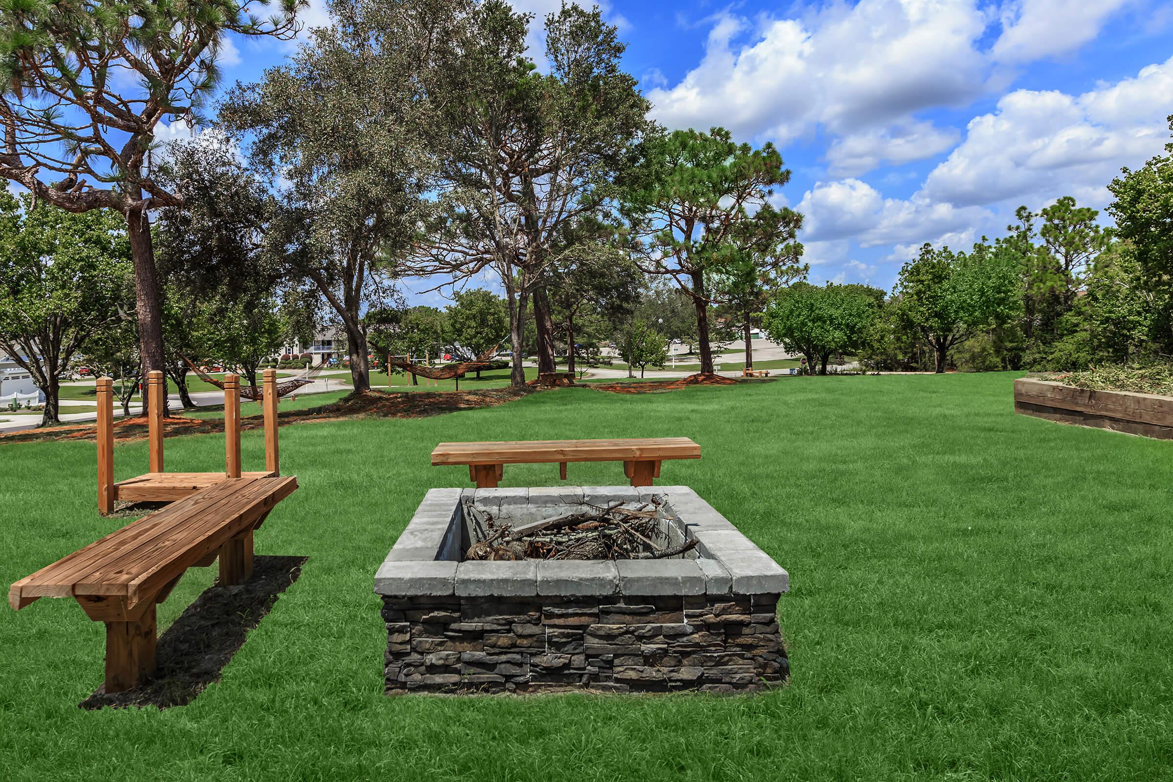 Fire pit and seating area at The Townhomes at Beau Rivage in Wilmington, NC.