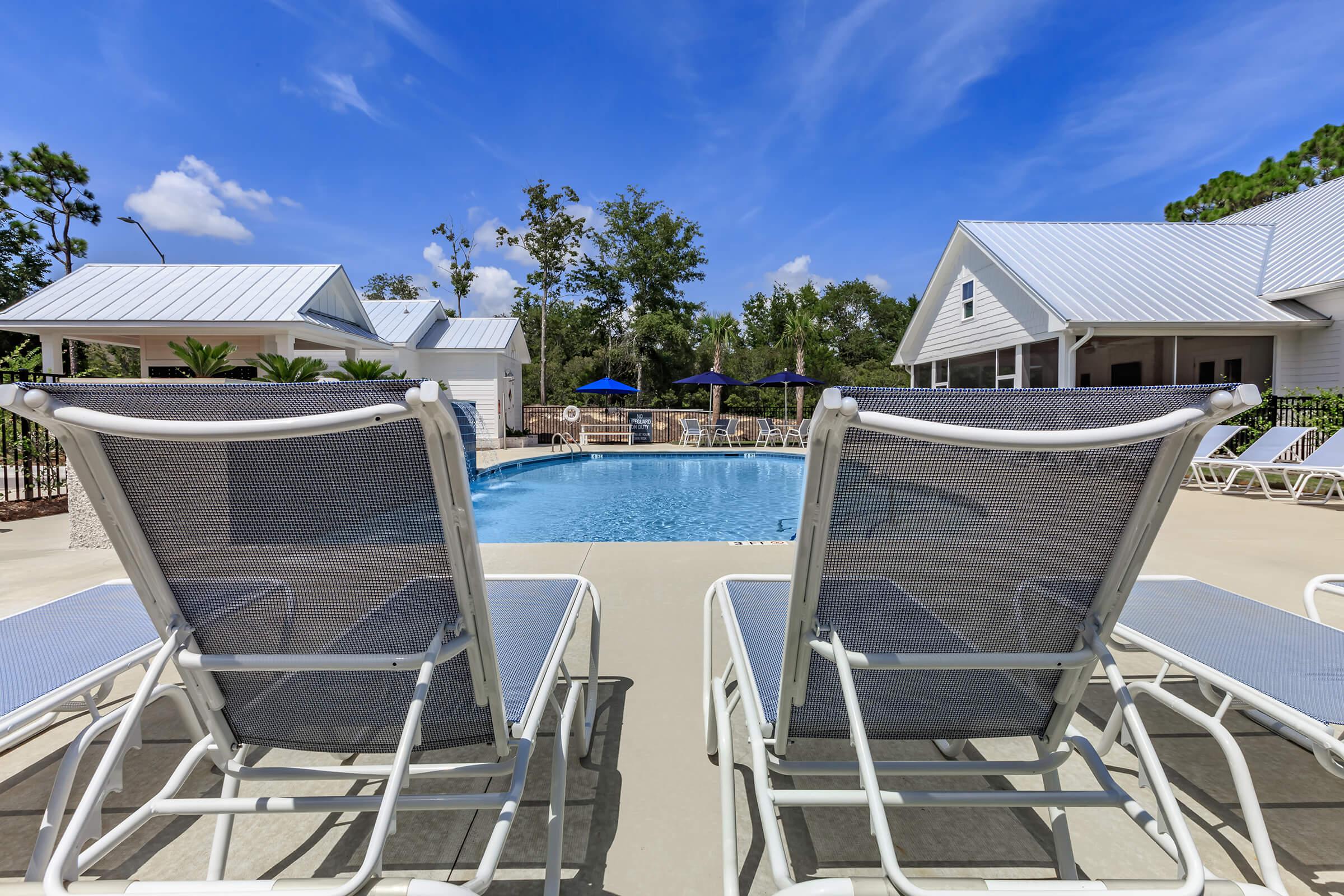 Relax by the pool at The Townhomes at Beau Rivage in Wilmington, NC.