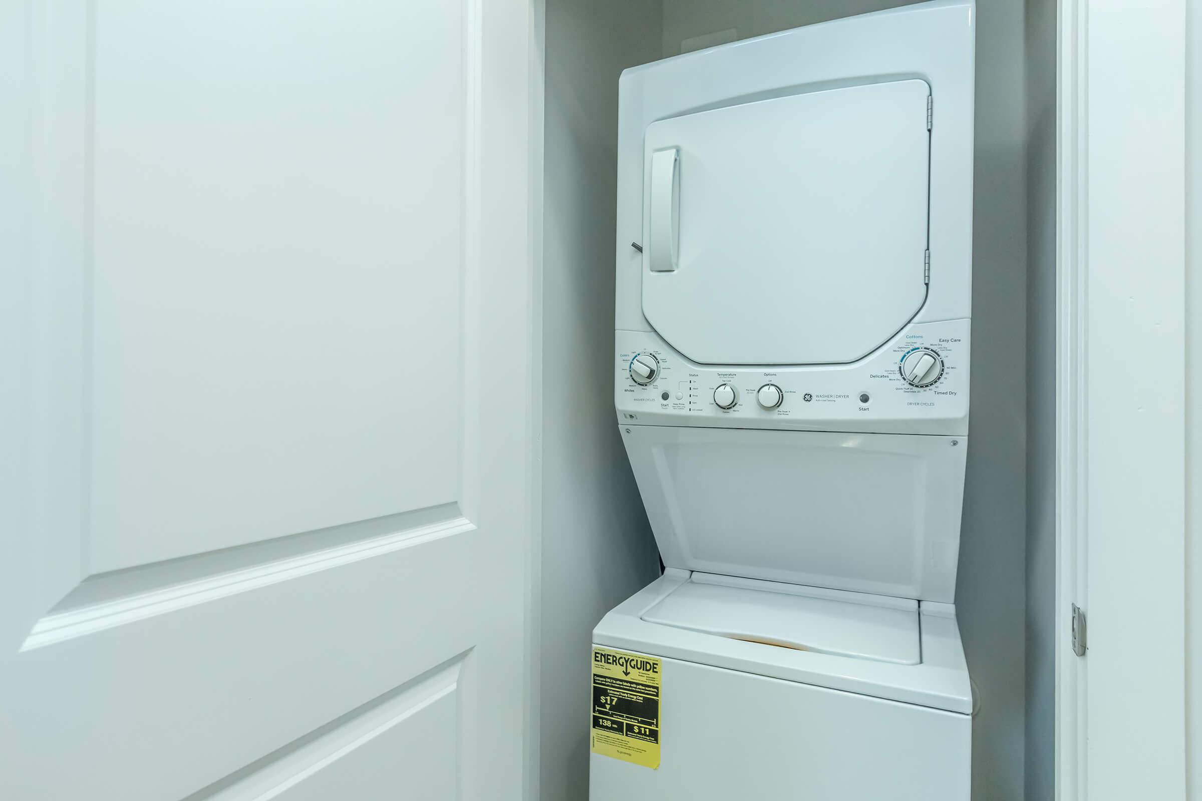 a microwave oven sitting on top of a refrigerator