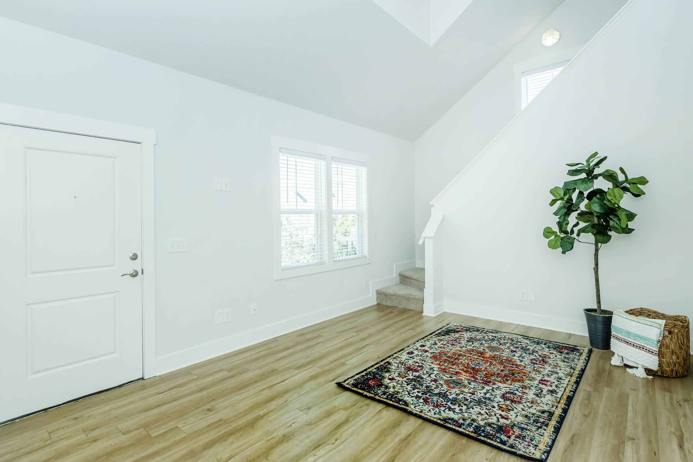 a bedroom with a wooden floor