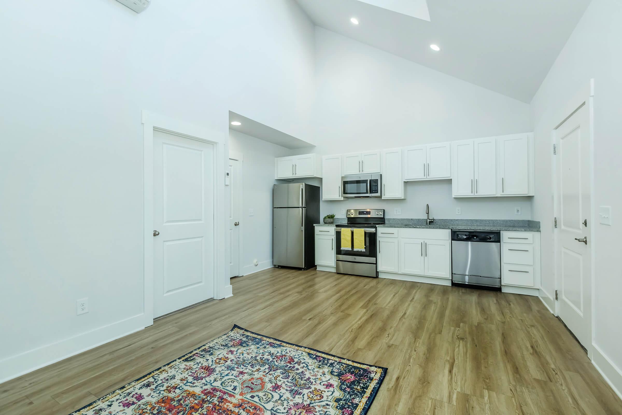 a kitchen with a wood floor