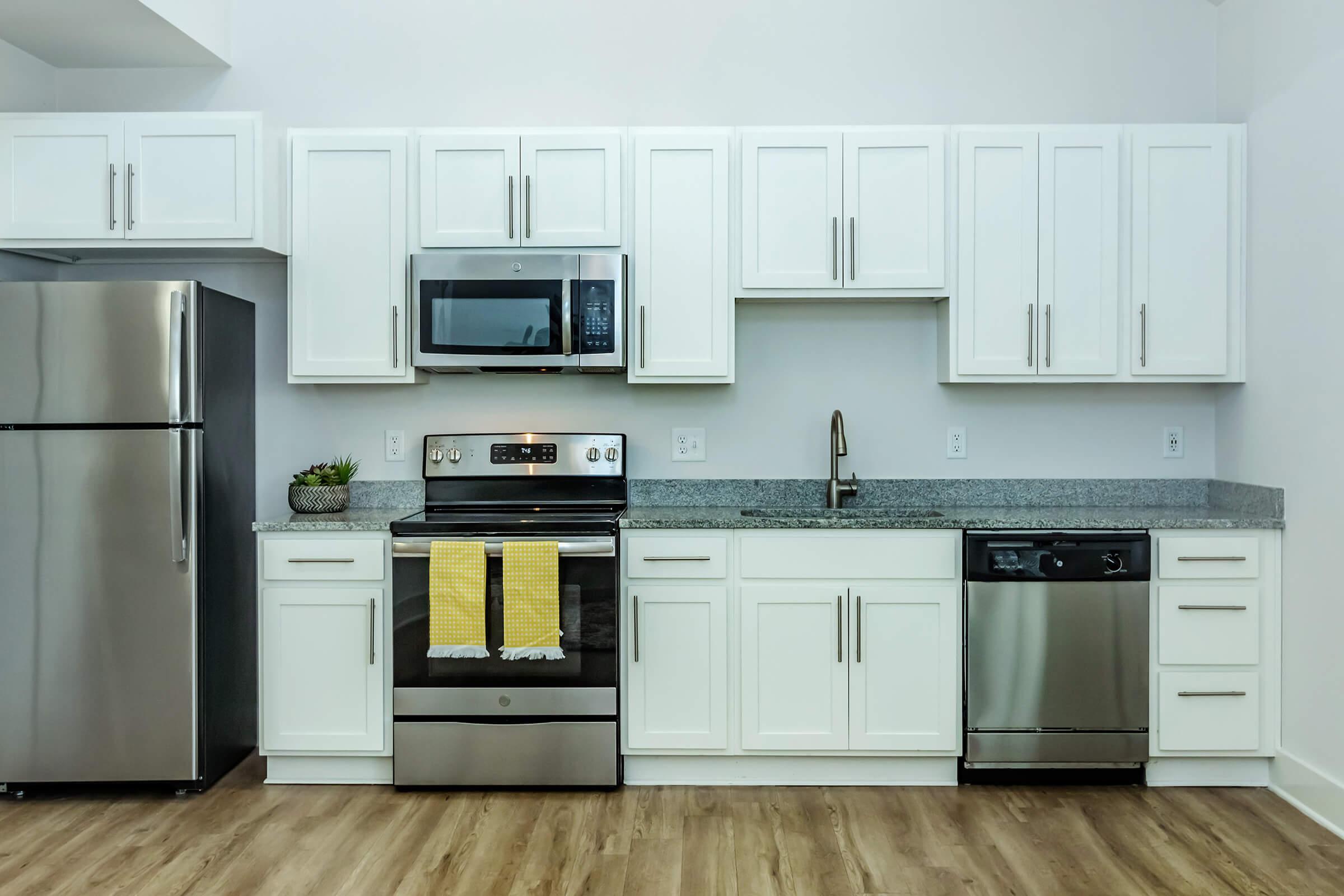 a kitchen with a stove top oven sitting inside of a refrigerator