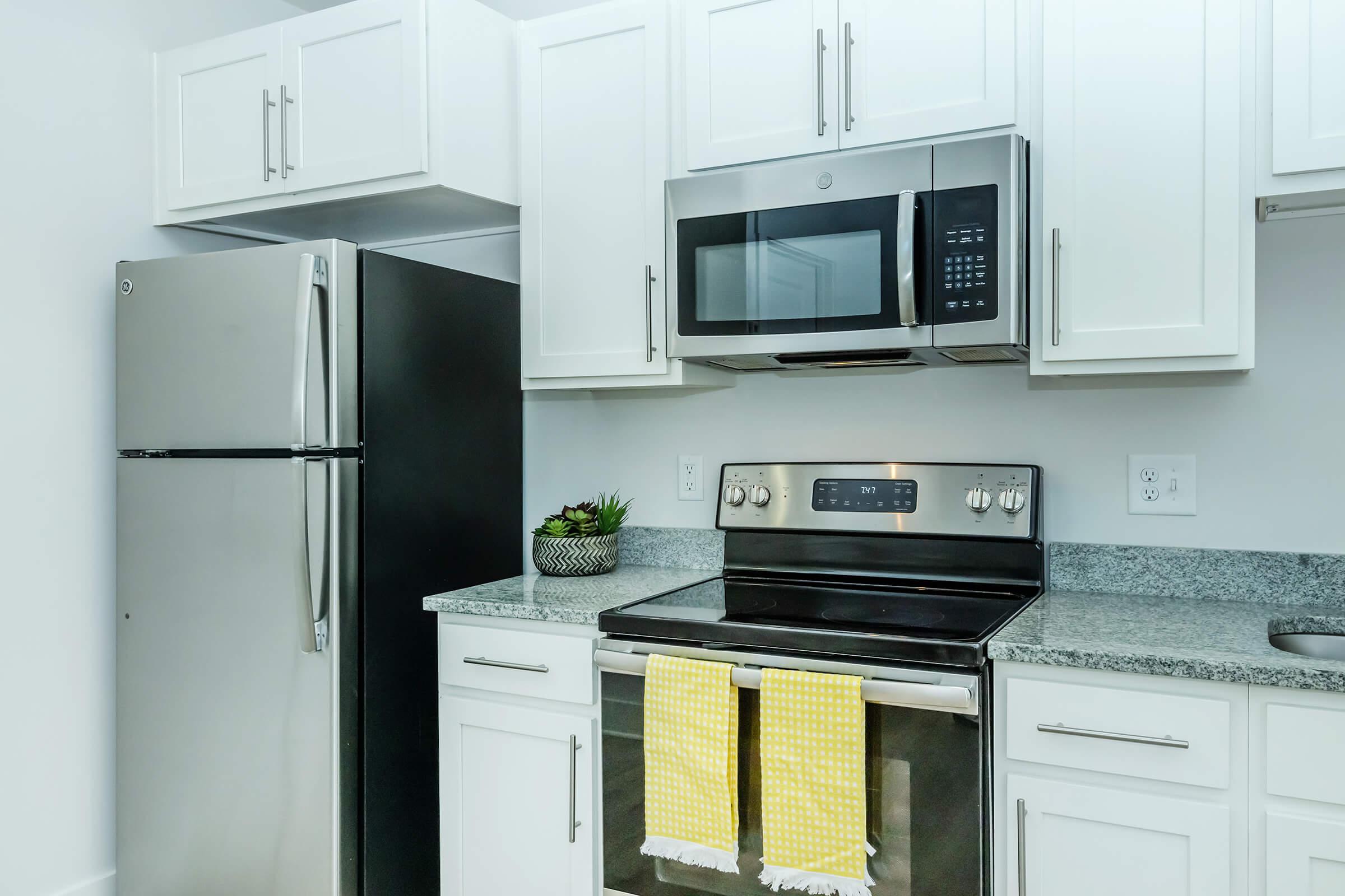 a kitchen with a stove top oven sitting inside of a refrigerator