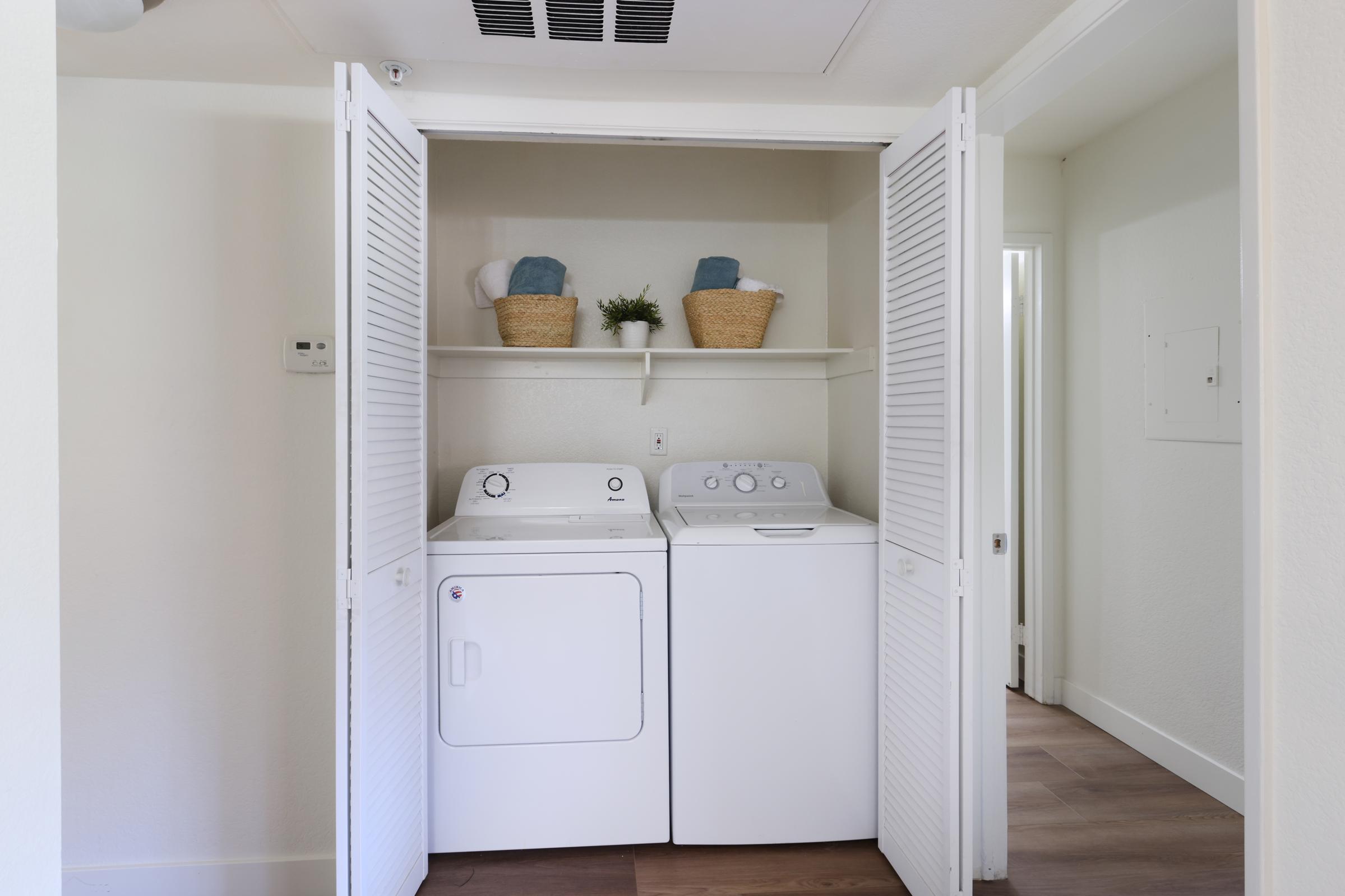 a kitchen with a sink and a refrigerator