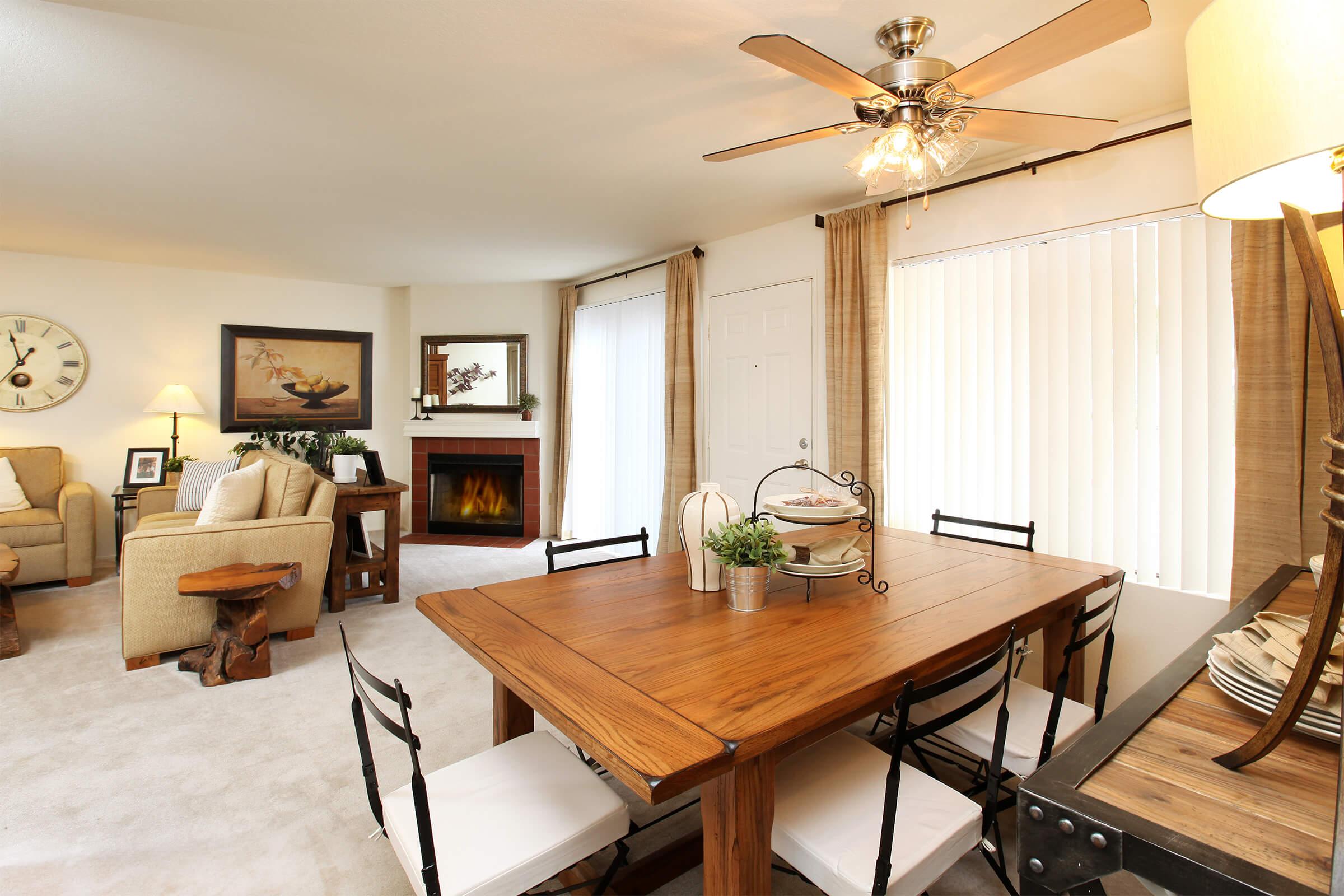 a living room filled with furniture and a table