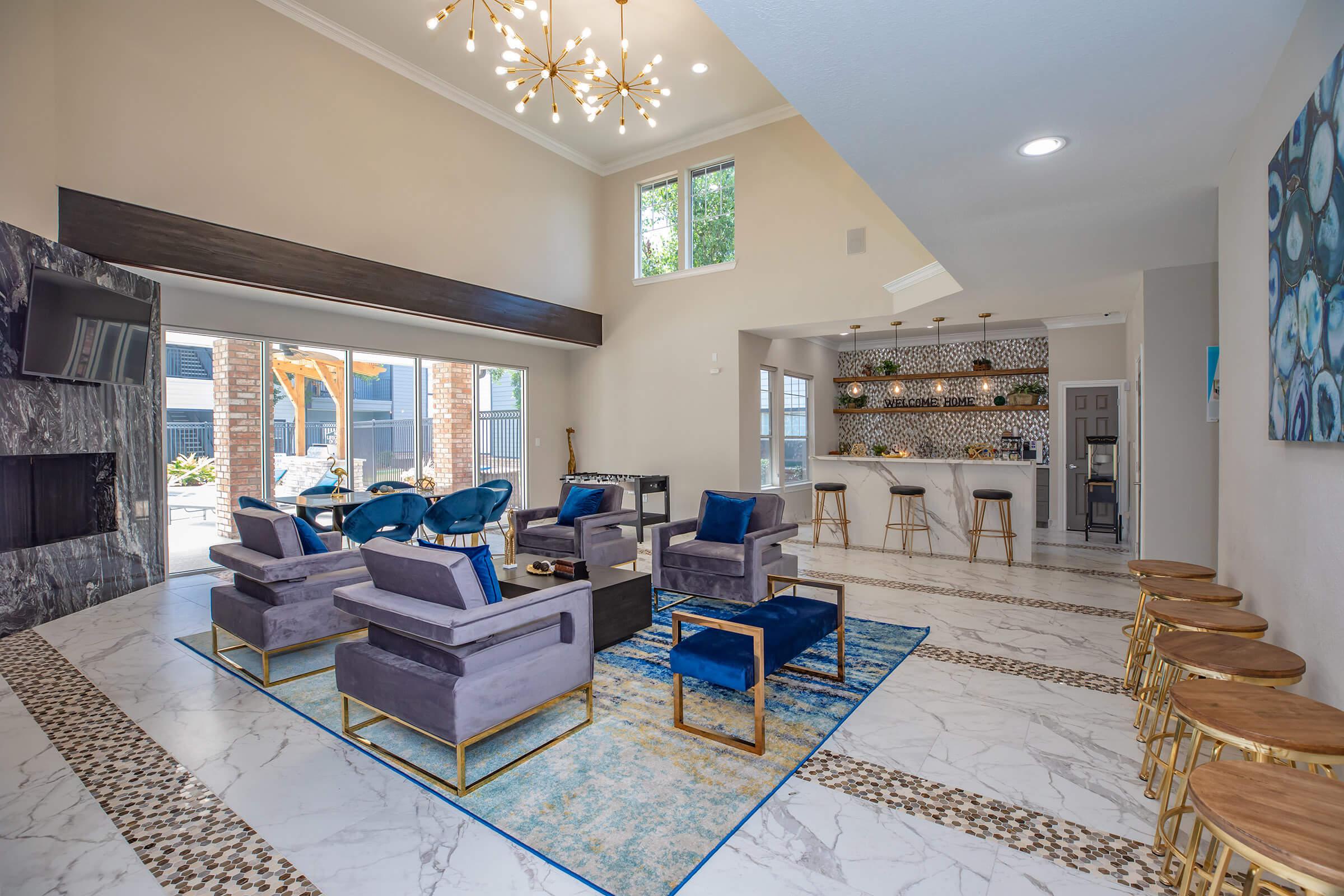 a living room filled with furniture and a large window