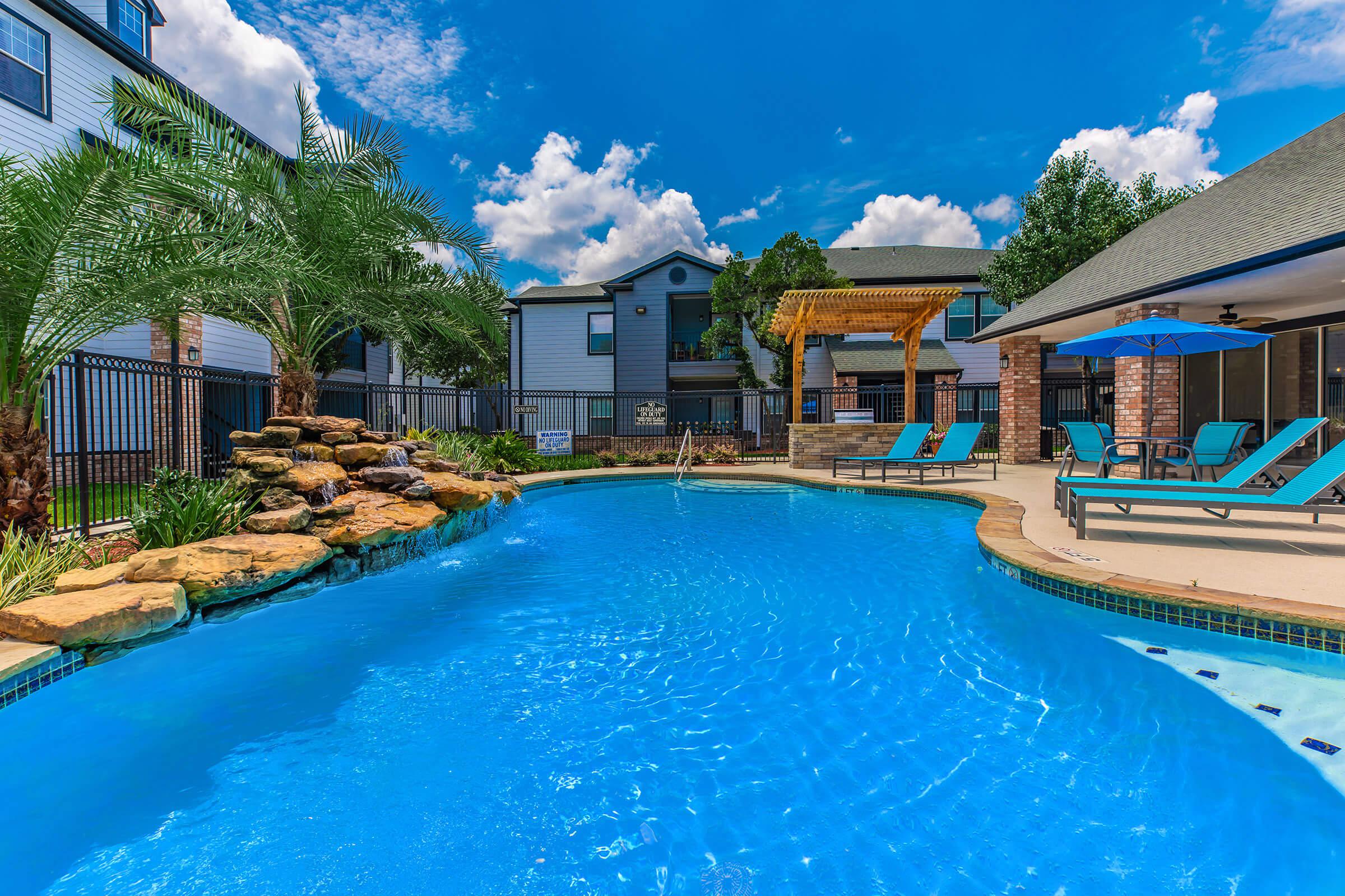 a house with a large pool of water