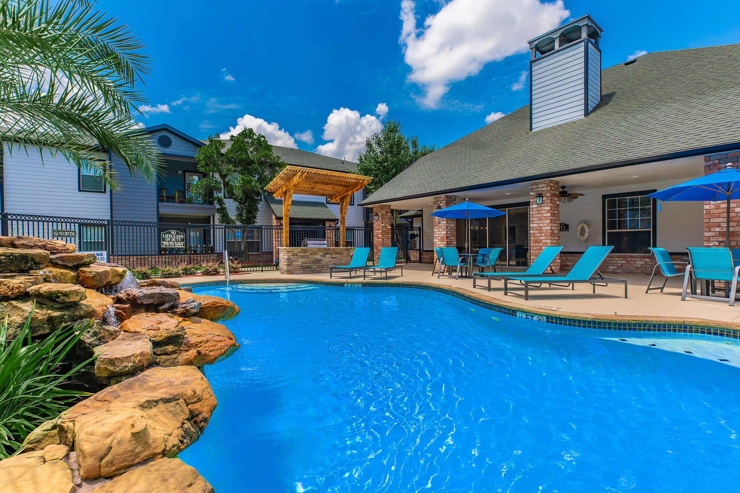 a house with a large pool of water