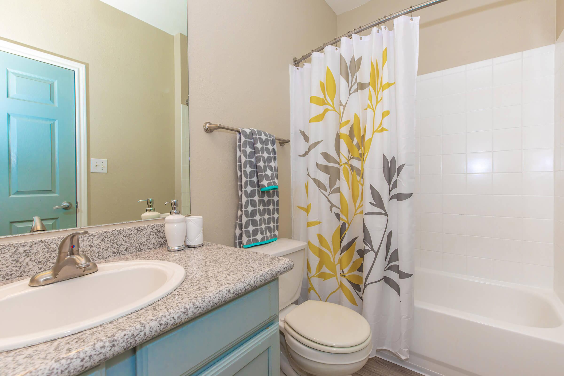 a room with a sink and a bath tub