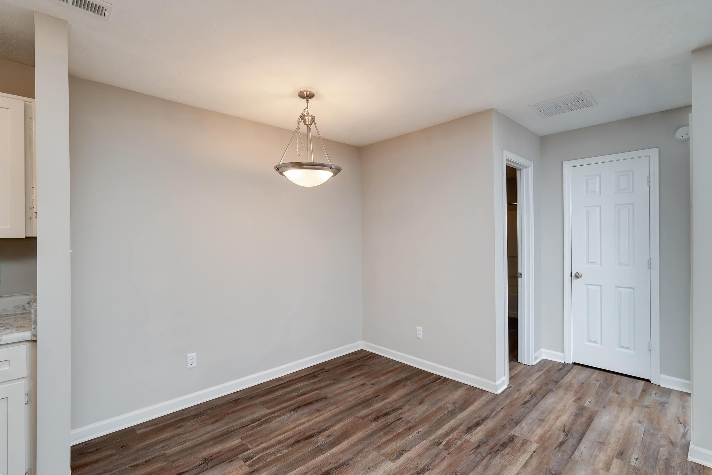 a kitchen with a wood floor