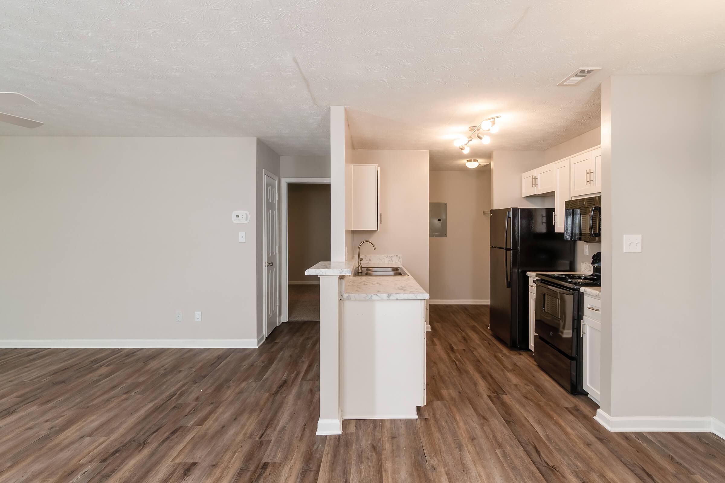 a kitchen with a wood floor