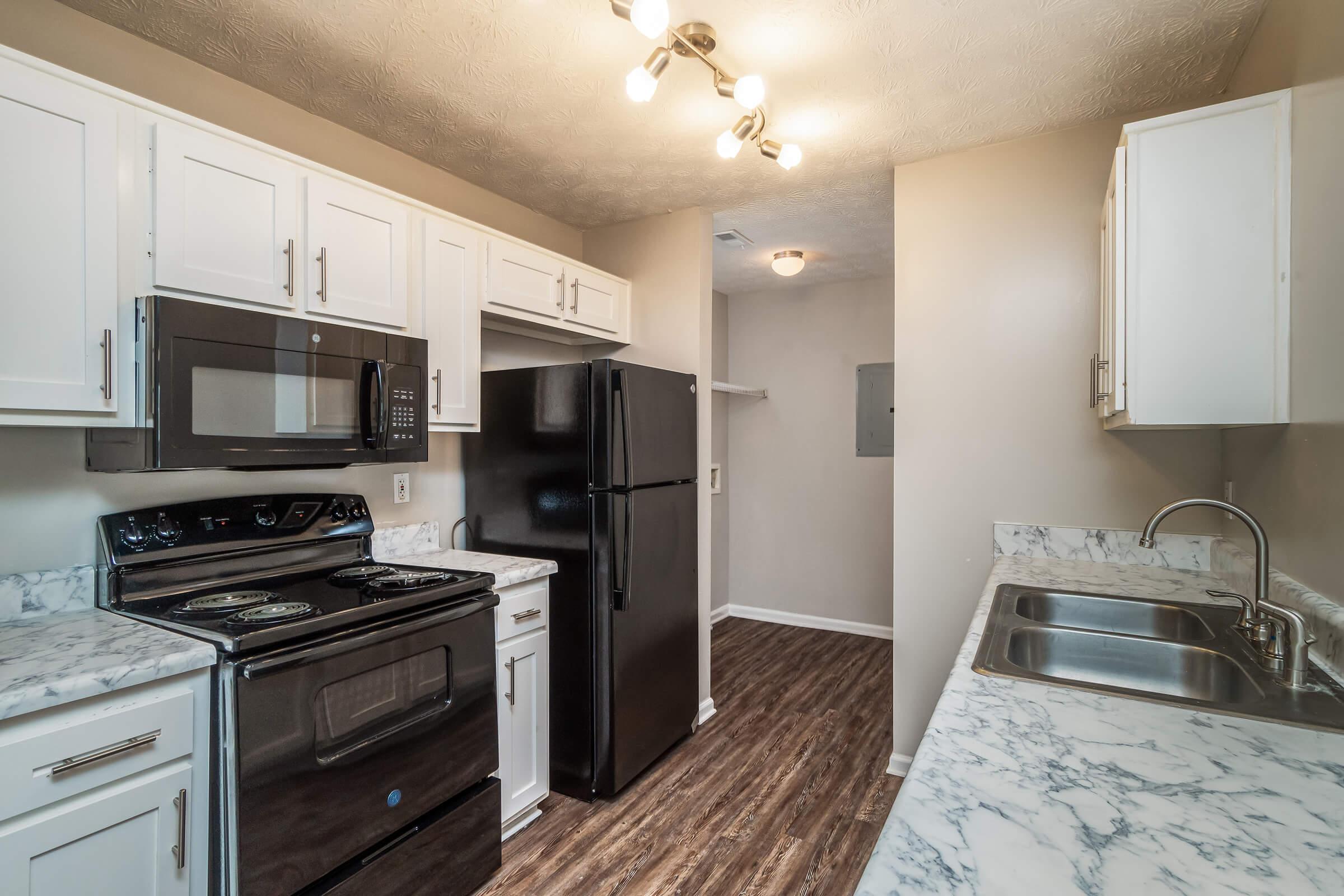 a kitchen with a stove top oven