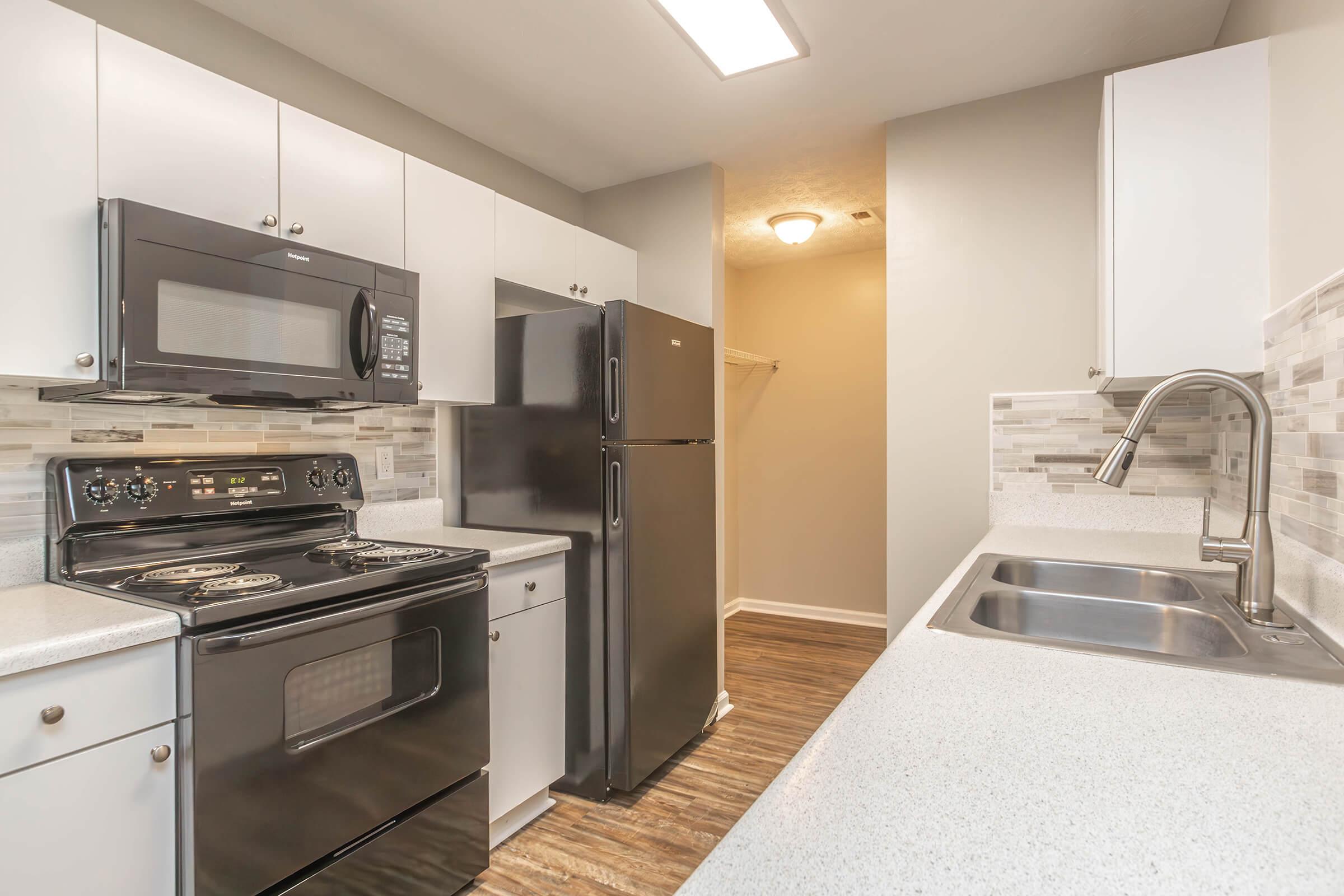 a large kitchen with stainless steel appliances