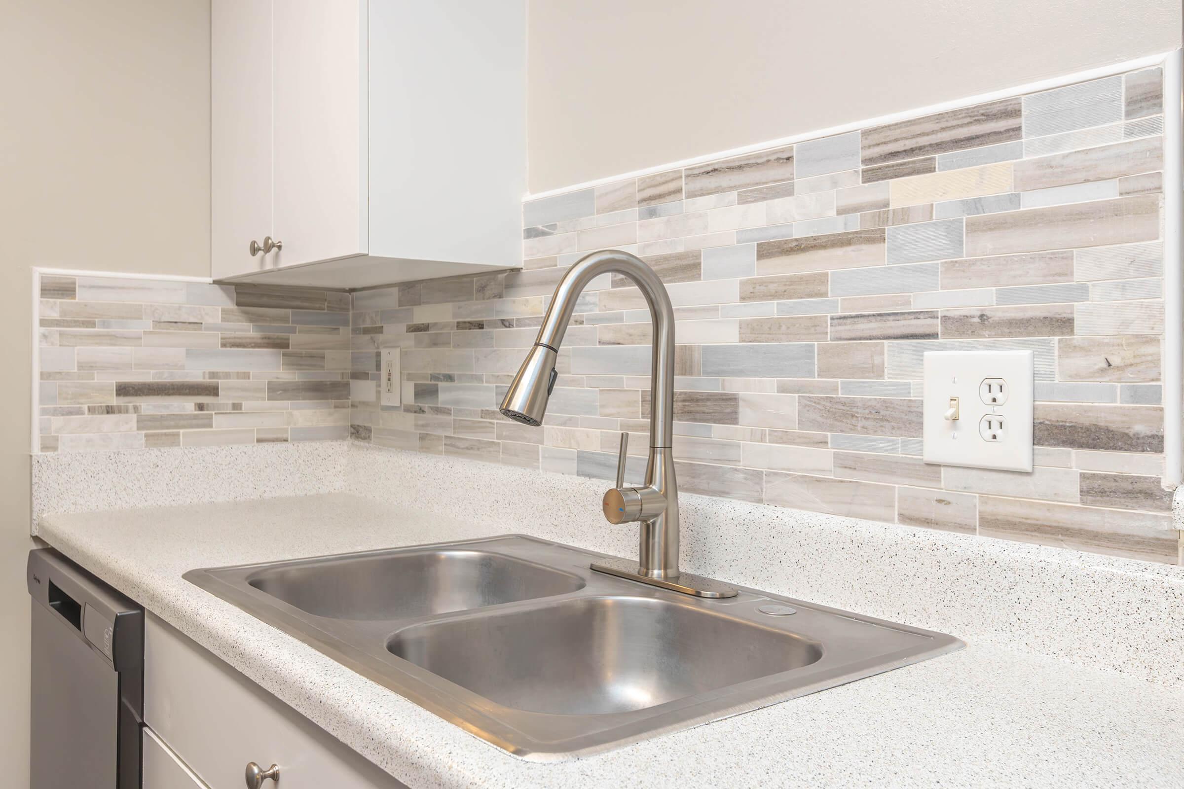 a kitchen with a sink and a microwave