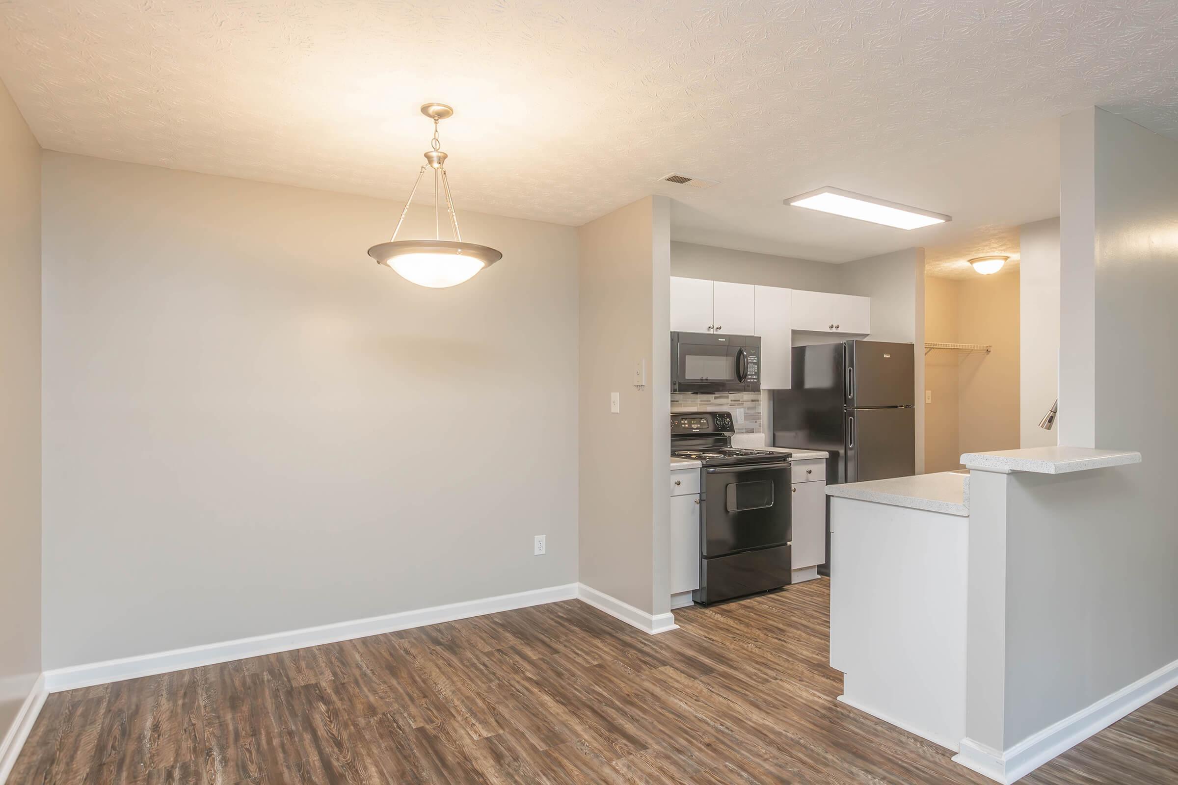 a kitchen with a sink and a refrigerator