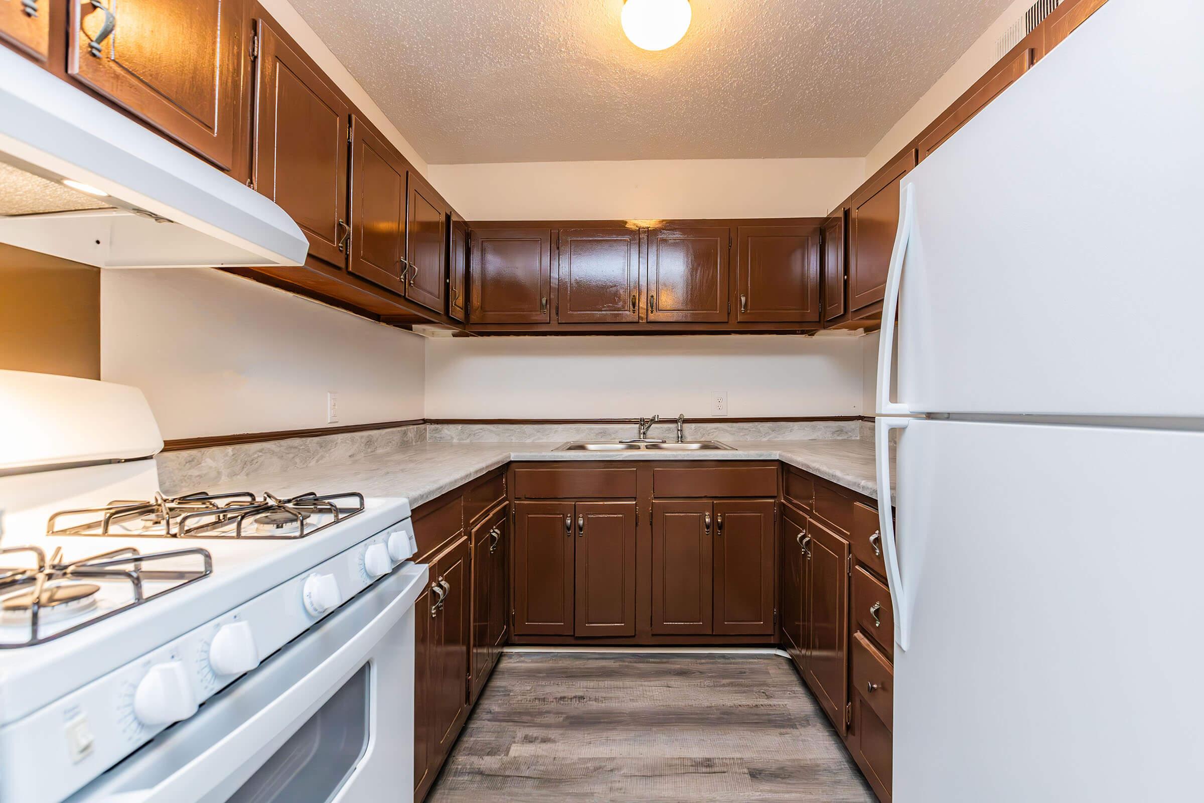 a kitchen with a stove top oven