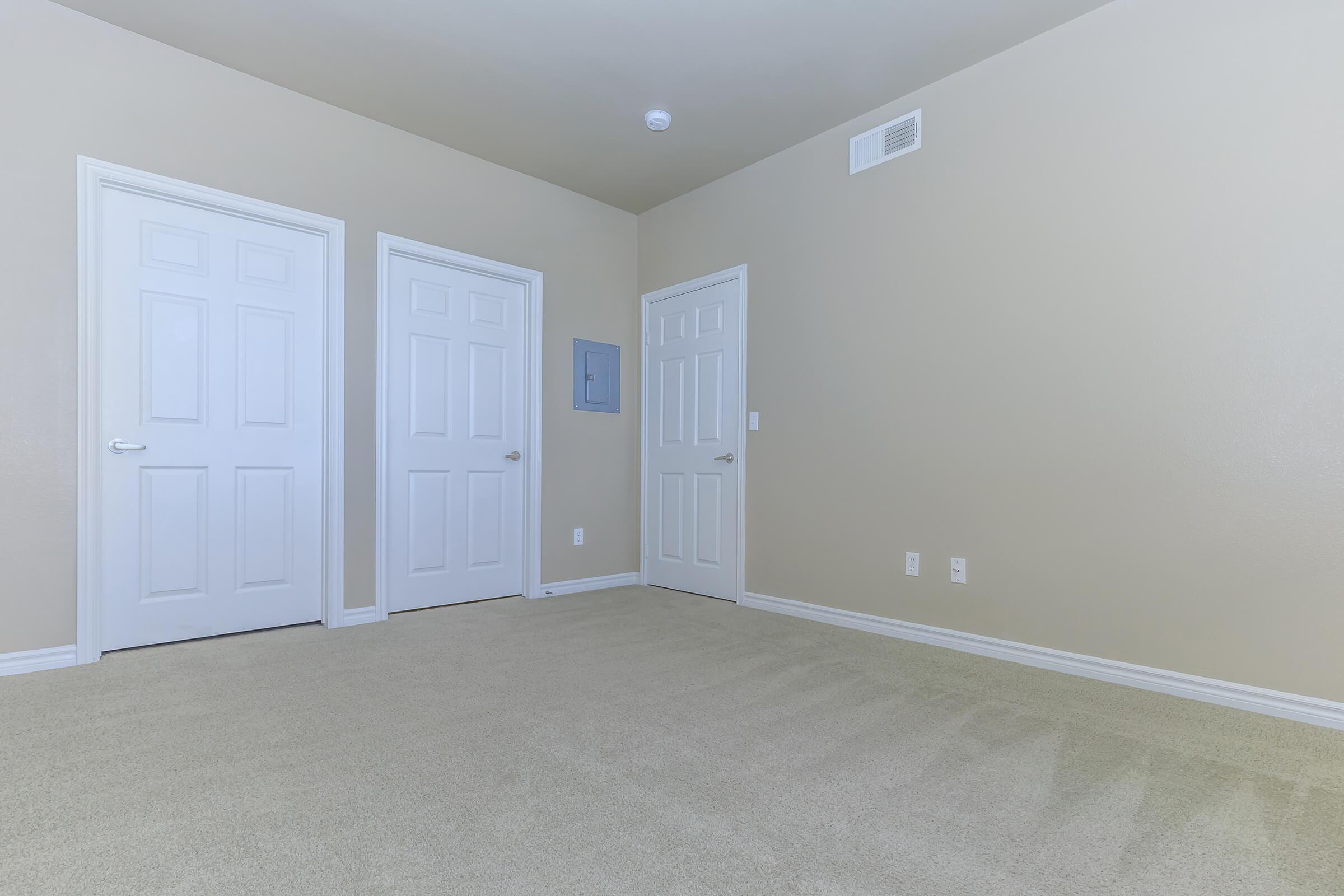 Vacant bedroom with carpet
