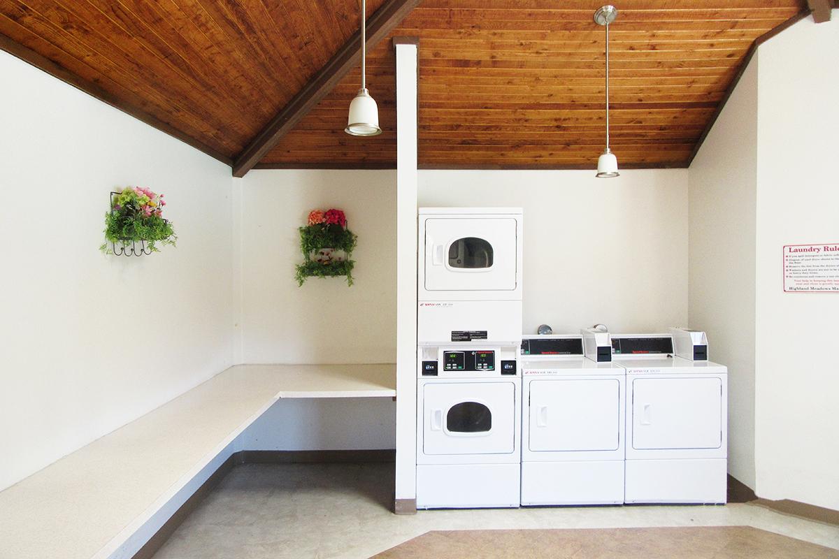 a white stove top oven sitting inside of a kitchen