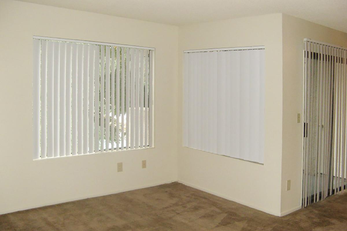 a large white refrigerator in a small room